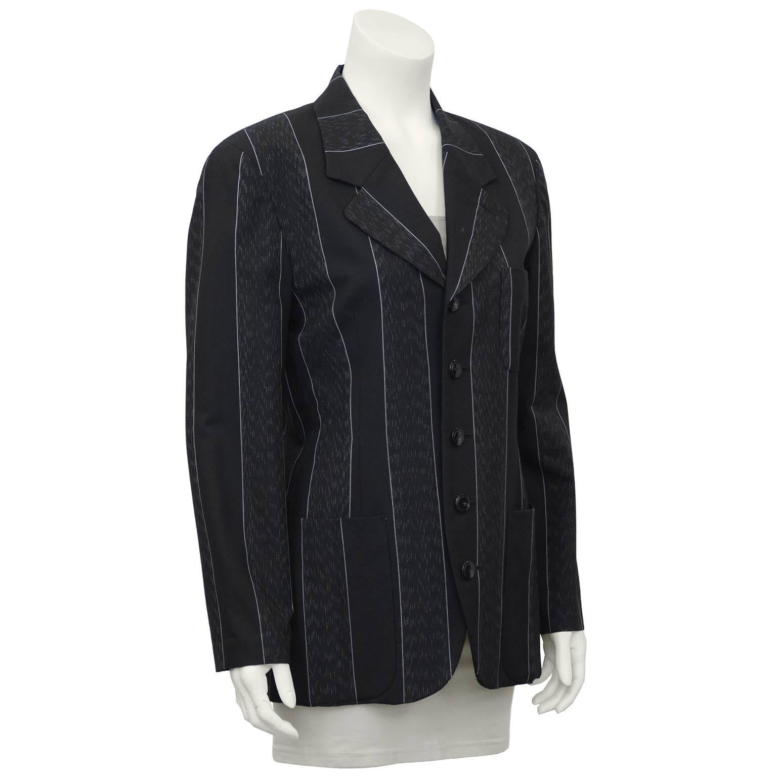 Japanese legendary designer Matsuhiro Matsuda grey wool pinstripe 5 button ladies blazer from the 1990's. Matsuda found success by interpreting classic British style, fabrics and tailoring then adding his own idiosyncratic Japanese humor to the