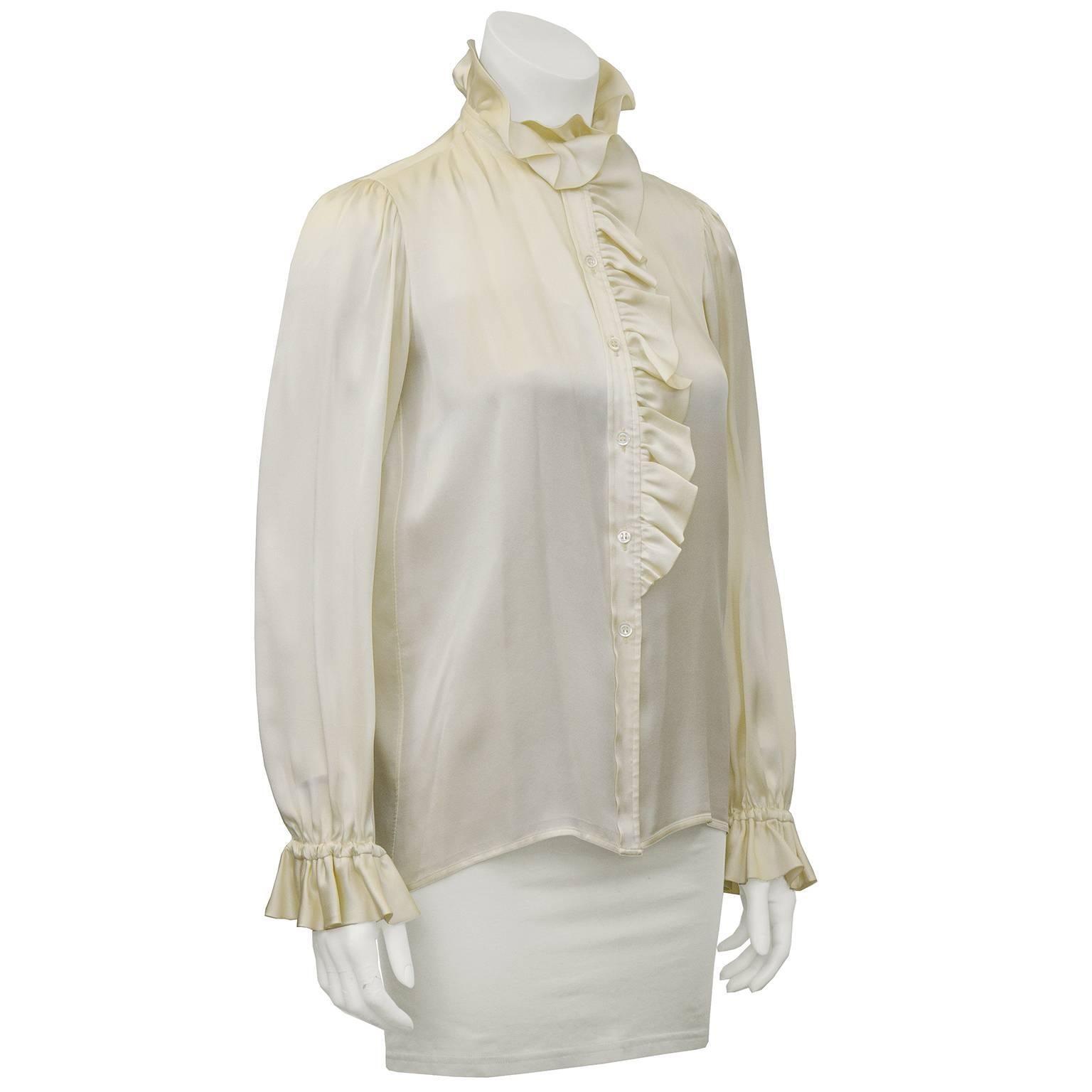 1970's Yves Saint Laurent/YSL silk satin ruffle neck and cuff front button blouse. Feminine and frilly, perfect touch to add to a classic jacket or over pants. In excellent condition, fits like a US 2.

Sleeve 16