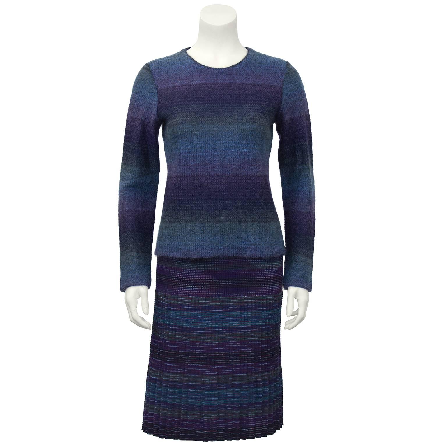1990's 3 piece Missoni skirt suit. The herring bone knit skirt with matching color top can be worn with our without the stunning knit herringbone blazer. All pieces are great as separates and as an ensemble. Navy, lavender, purple, black and teal