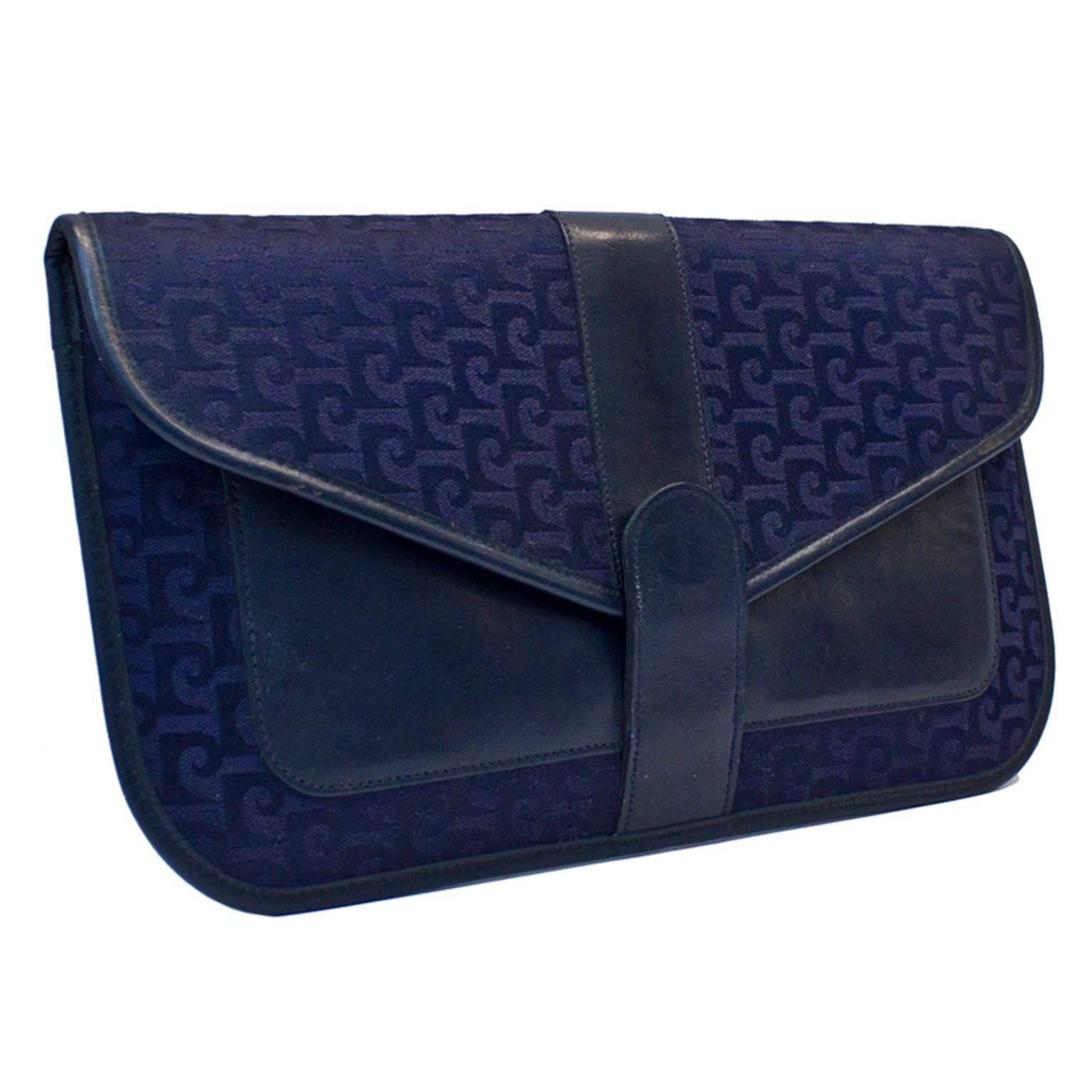 The best Pierre Cardin Navy Logo clutch I have ever found. In excellent vintage condition. Dates from the 1960's. Signature fabric interior. One zipper compartment, leather trim and leather exterior pouch. Snap closure. No sign of wear.

Length