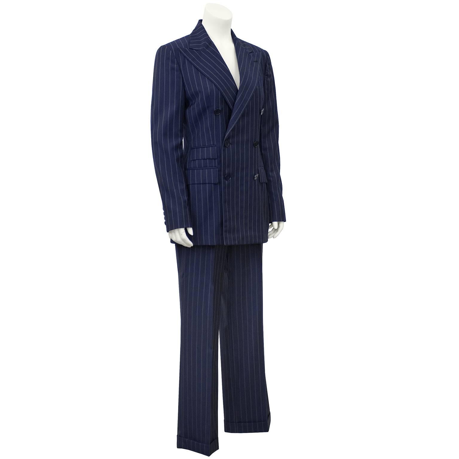 1990's Ralph Lauren Collection Classics navy blue and grey light weight wool pin stripe double breasted pant suit. Blazer features exaggerated collar and 3 flap pockets. Pants are high waisted, pleated and cuffed. Excellent vintage condition. Ralph