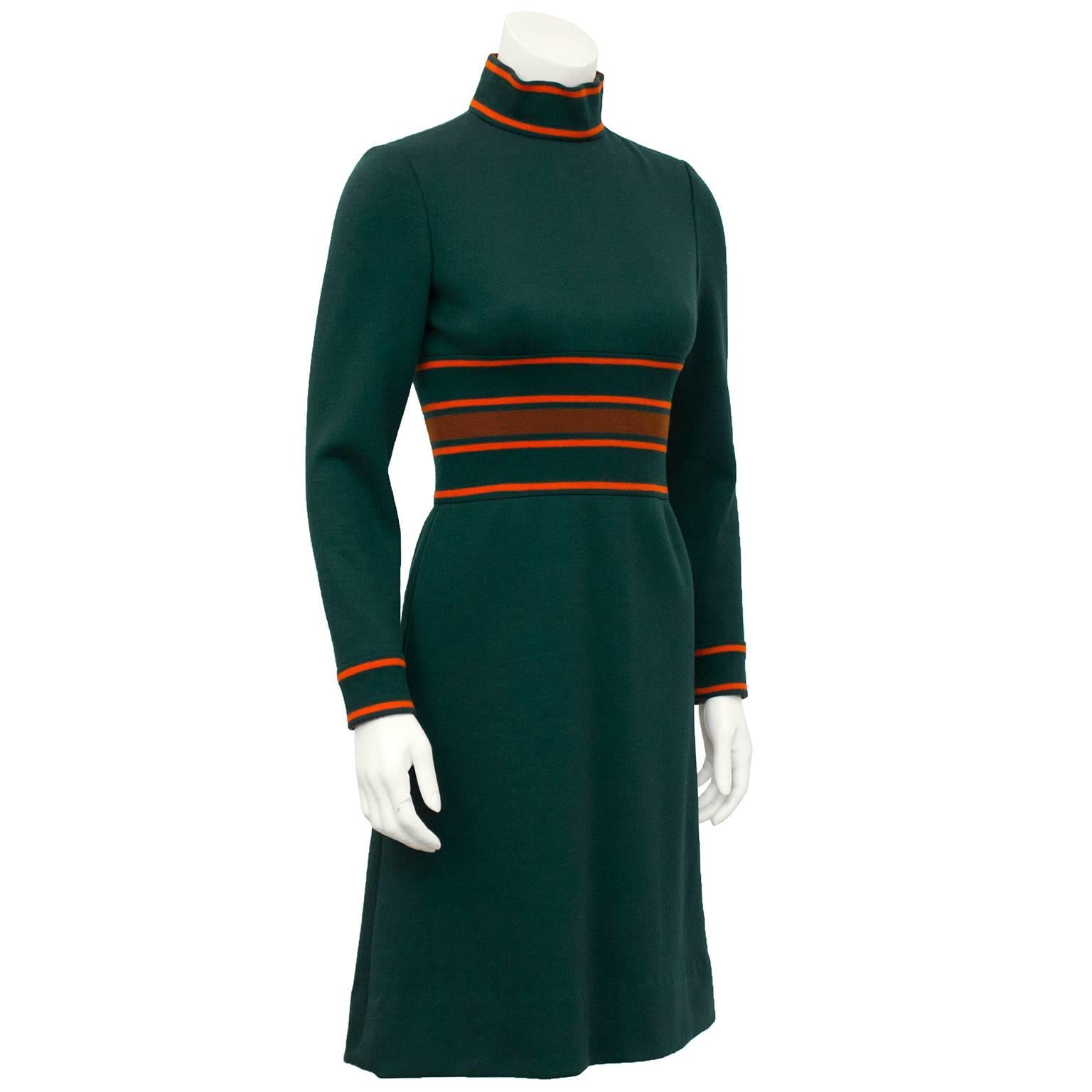 1960's forest green Pierre Cardin knit turtleneck dress. Orange stripe ribbed detailing at neck, waist and cuffs. Slight a-line flare to skirt. Excellent transition piece for fall to winter. Excellent vintage condition, fits like a US 4. 

Sleeve