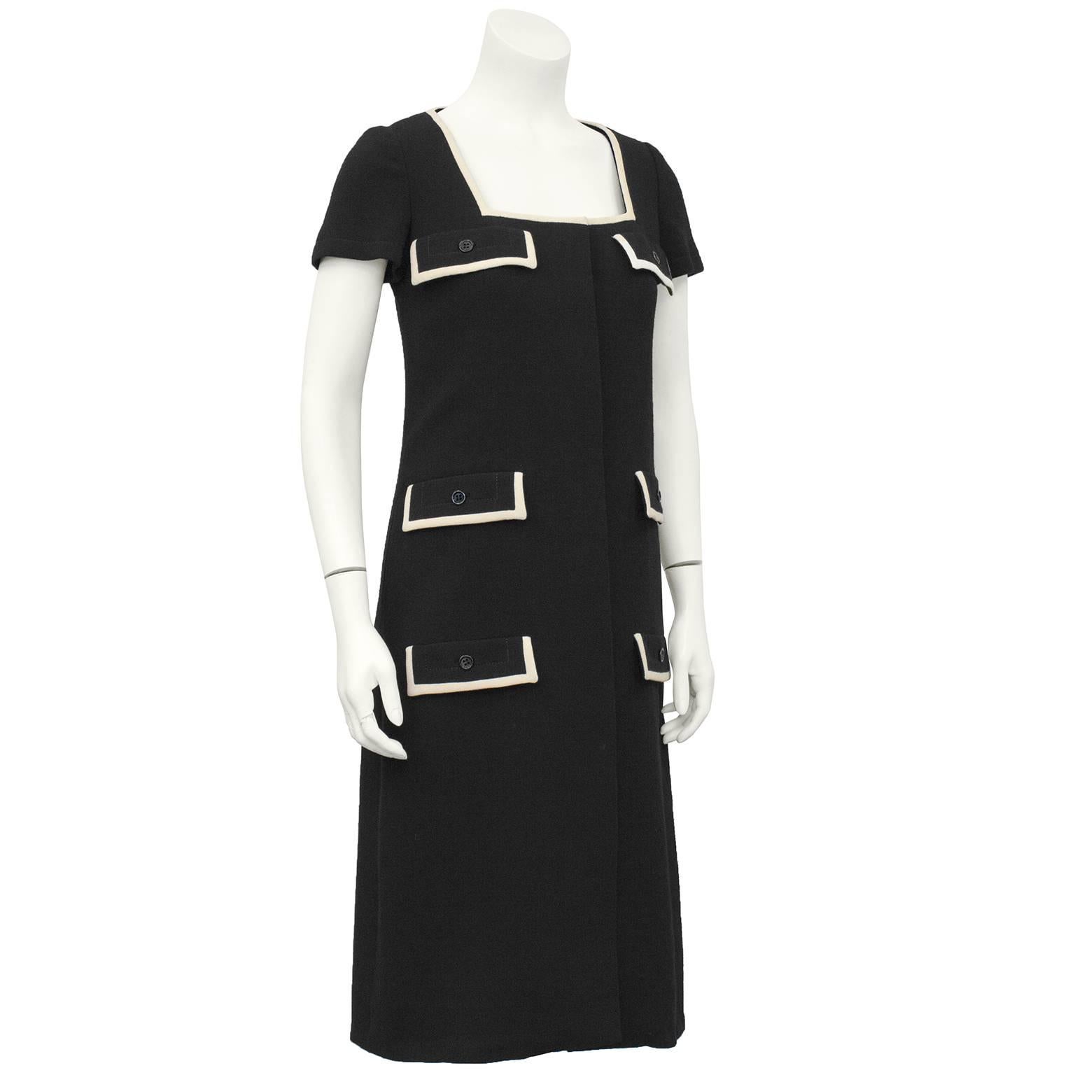 Quintessential 1960's Galanos black wool shift dress with faux flap pocket details and cream wool trim. Square neckline with invisible button closures down front centre. Excellent vintage condition, fits like a US 4-6. perfect fall fashion