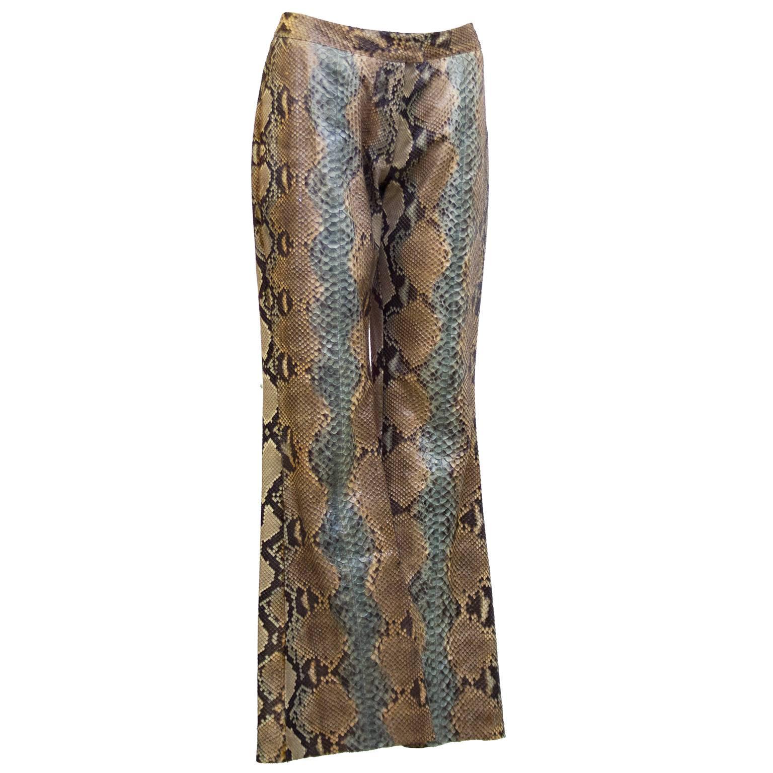 Immaculate genuine python leather trousers by Tom Ford for Gucci from SS2000. Natural color with dusty rose and light turquoise accent down the front of the flared leg. Zipper and tab closure. Marked IT 40. Fits like a US 2-4. In excellent unused