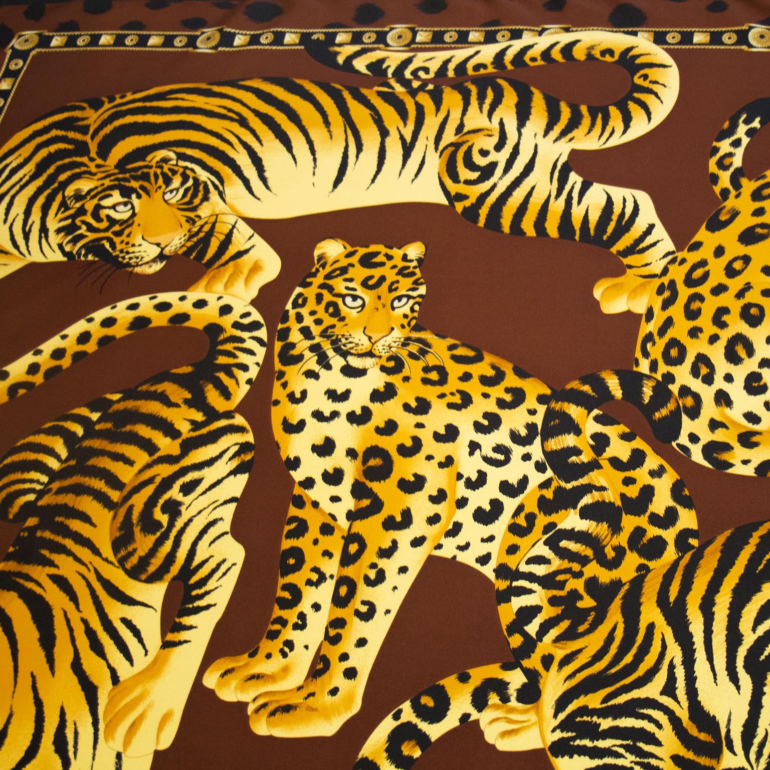 Lanvin brown, black and orange silk scarf featuring tigers and leopards from the 1980s. Detailed border with LL at the bottom center and signed LANVIN PARIS on the bottom right corner. In excellent condition. 

35