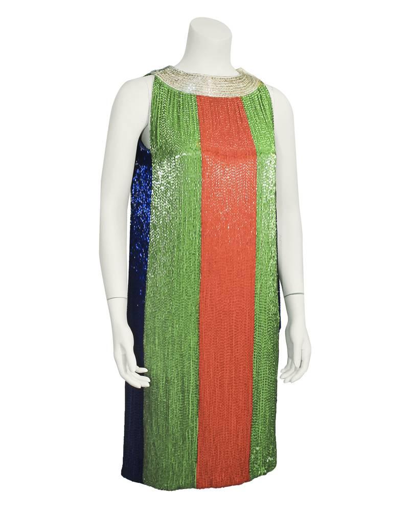 Legendary Hollywood costume designer Jean Louis created this absolutely stunning 1960's hand beaded sac style dress.  Panels of Kelly green, orange, midnight blue and silver beading with a silver beaded neckline. Great vibrant colors and a classic