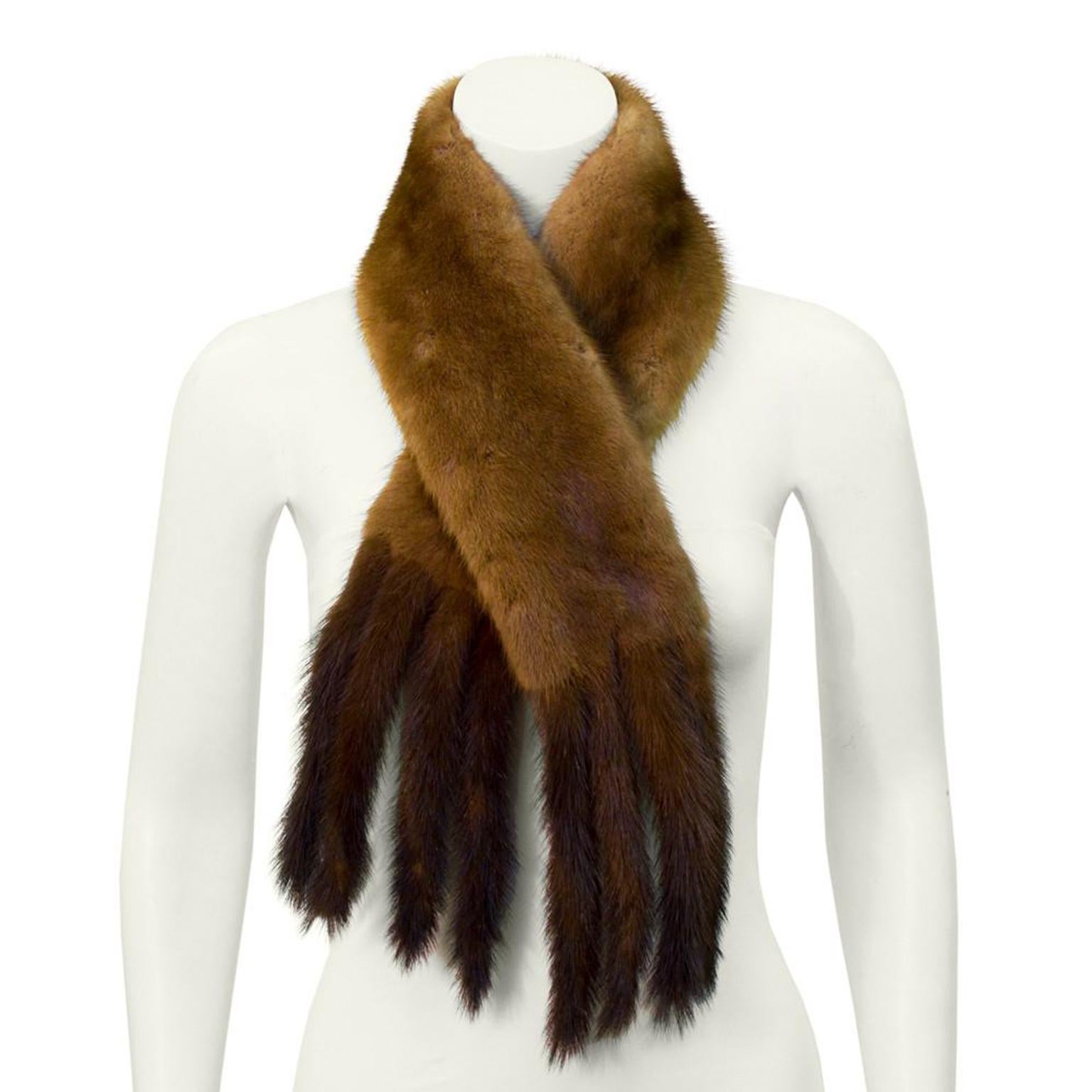 Early 1960's brown mink Christian Dior Paris scarf. Rectangular in shape and trimmed with eight mink tails. Timeless piece in excellent vintage condition.