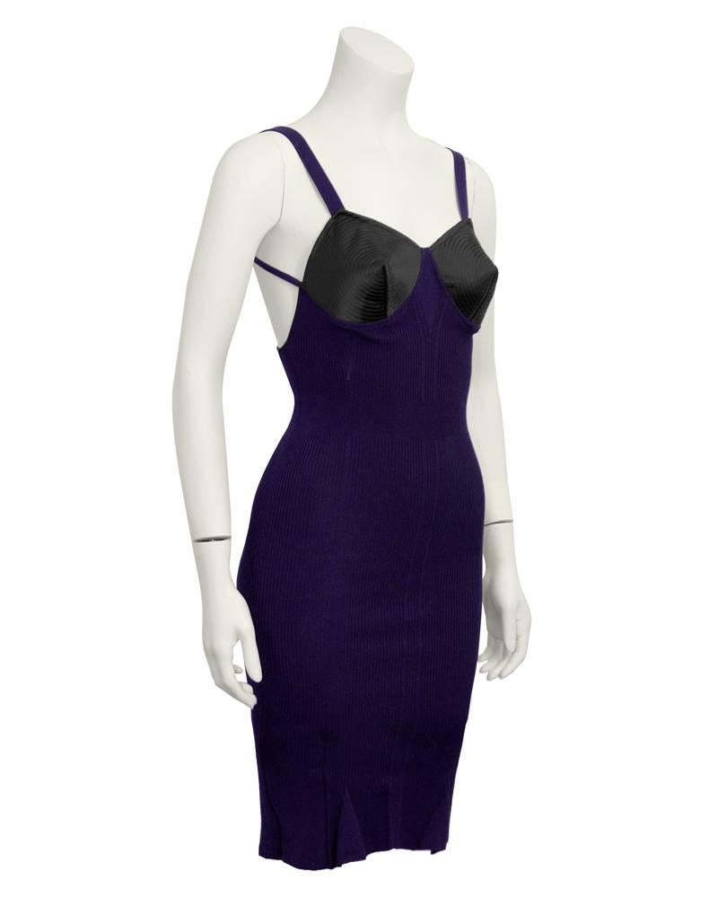 Iconic, collectable and über sexy 1980s Jean Paul Gaultier purple body con dress with an exaggerated black cone shaped bust. Circular, spiral seam work on bust and body is ribbed. Open, sexy back with criss cross straps. Tiny inverted pleats at the