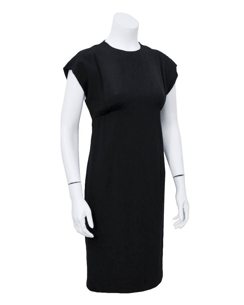 Cute and chic 1960's Geoffrey Beene black  silk crepe cocktail dress. Empire waist and cap sleeve. Perfect for nearly any occasion. Invisible zipper closure up back. Excellent vintage condition. Fits a size 2-4 US.