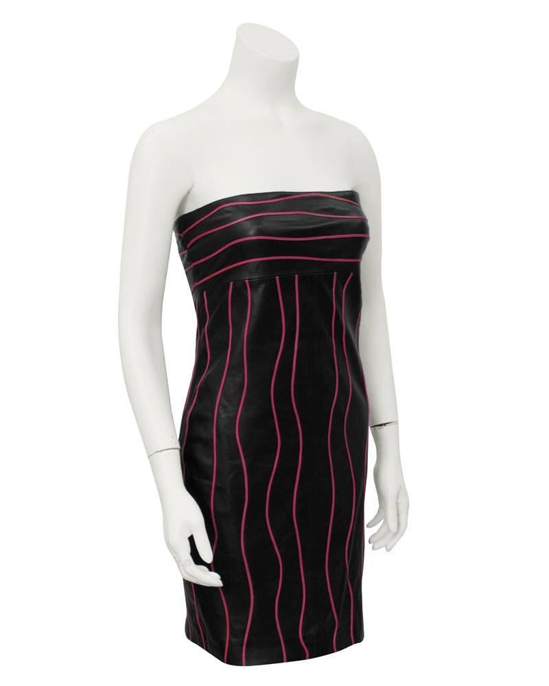 Sexy 1980's Mario Valentino black leather strapless body con dress. Thin hot pink leather squiggly horizontal stripes around the bust and vertical down the body. Excellent vintage condition.