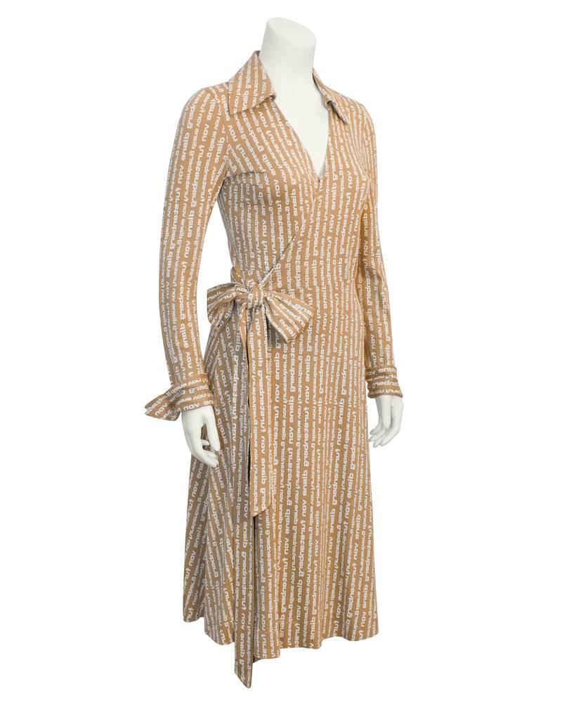 Original edition 1970's DVF wrap dress in cotton jersey made with the the Diane Von Furstenberg logo printed fabric. V-neck, tie waist, iconic fashion piece in excellent vintage condition. Some things never change for a good reason. Fits like a US