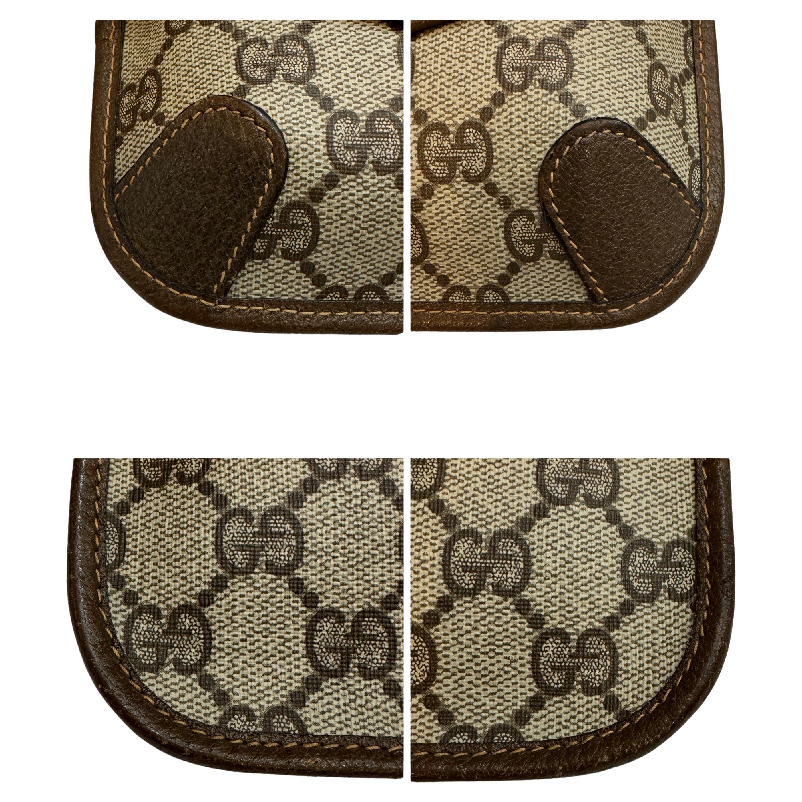 This vintage GUCCI pouch bag is crafted of GG monogram canvas in brown trimmed with brown pigskin leather. Front snap closure opens to an un-lined interior. This pouch has been altered by adding metal eyelets on the back to secure a chain. Made in