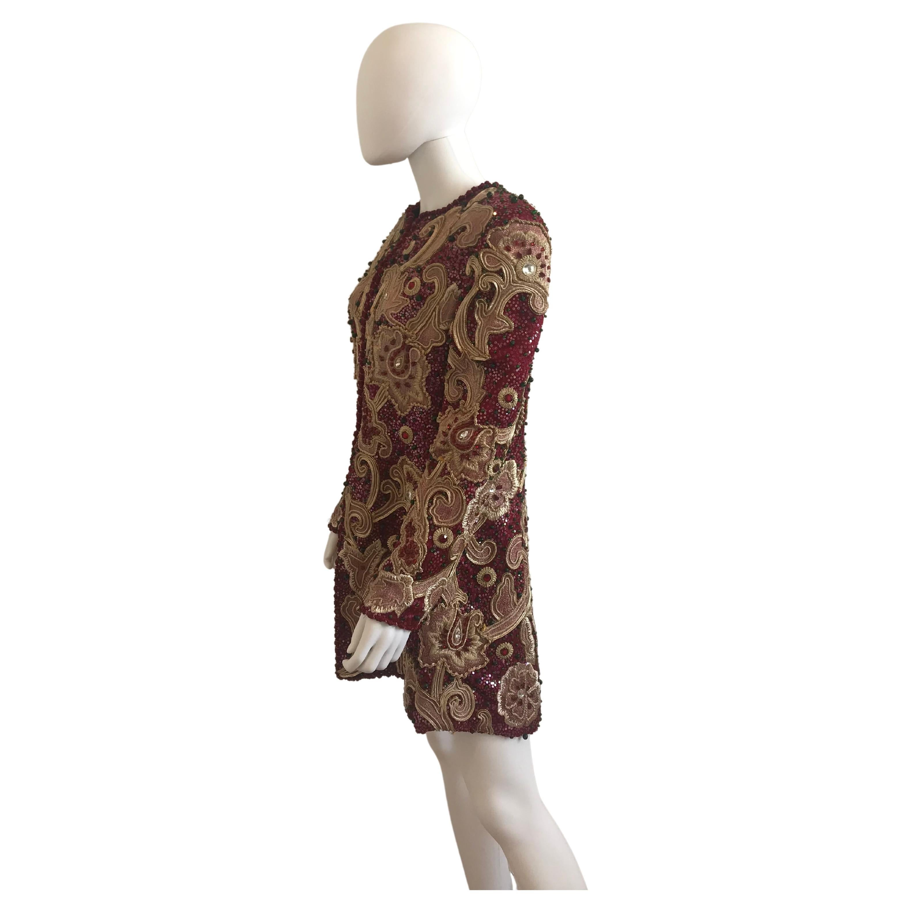 Beautiful 1980's-90's Mary McFadden Floral and Brocade Evening Coat. Burgundy, Gold, and emerald bead detailing. Zip closure in the front. Size US 10. Silk interior. Original Pristine Condition. 