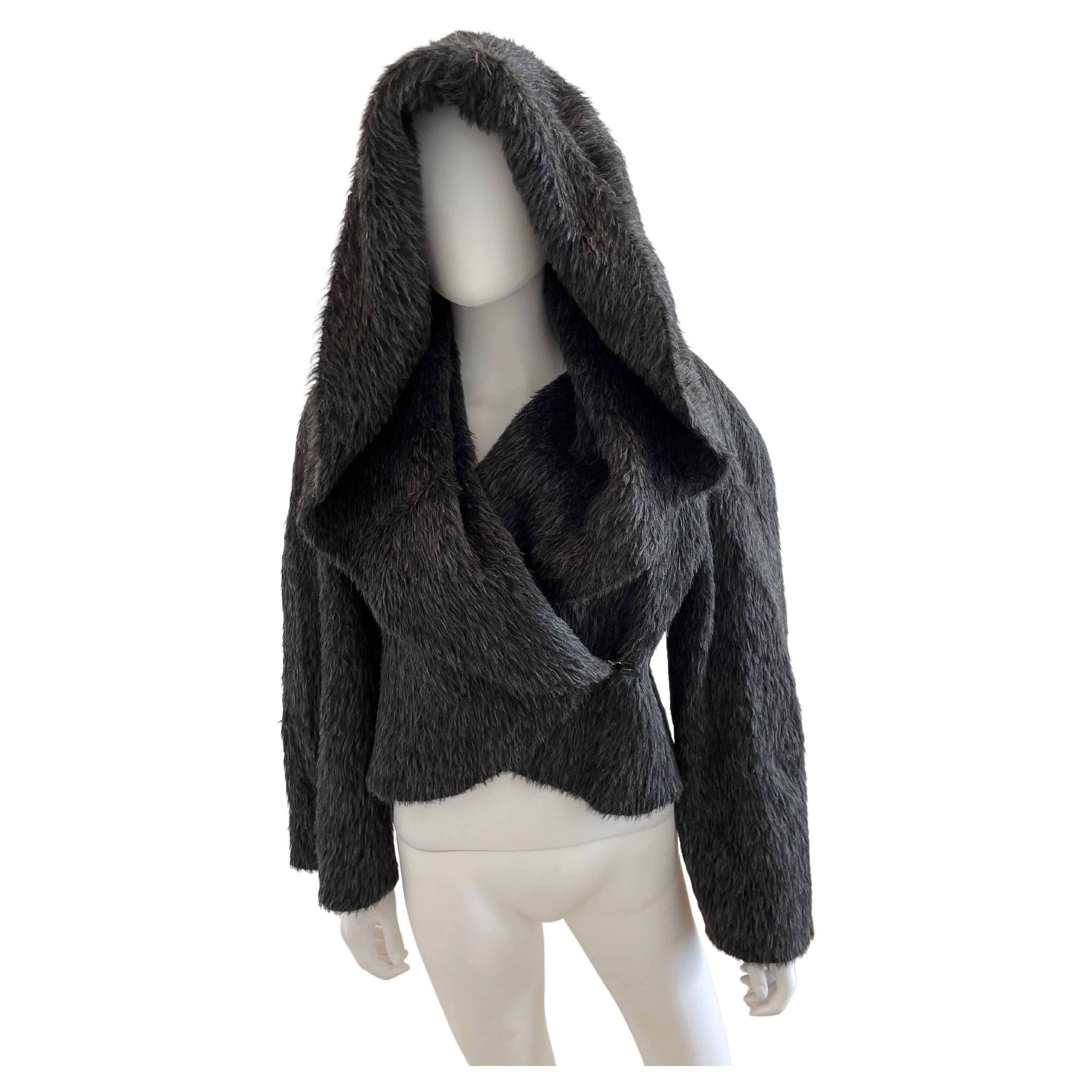 Gorgeous rare Charcoal Gianfranco Ferre alpaca and wool-blend jacket with fur trim featuring long sleeves, hood and hook-and-eye closure at front. Size 42.

Fabric: 65% Alpaca, 35% Wool; Lining 100% Opossum