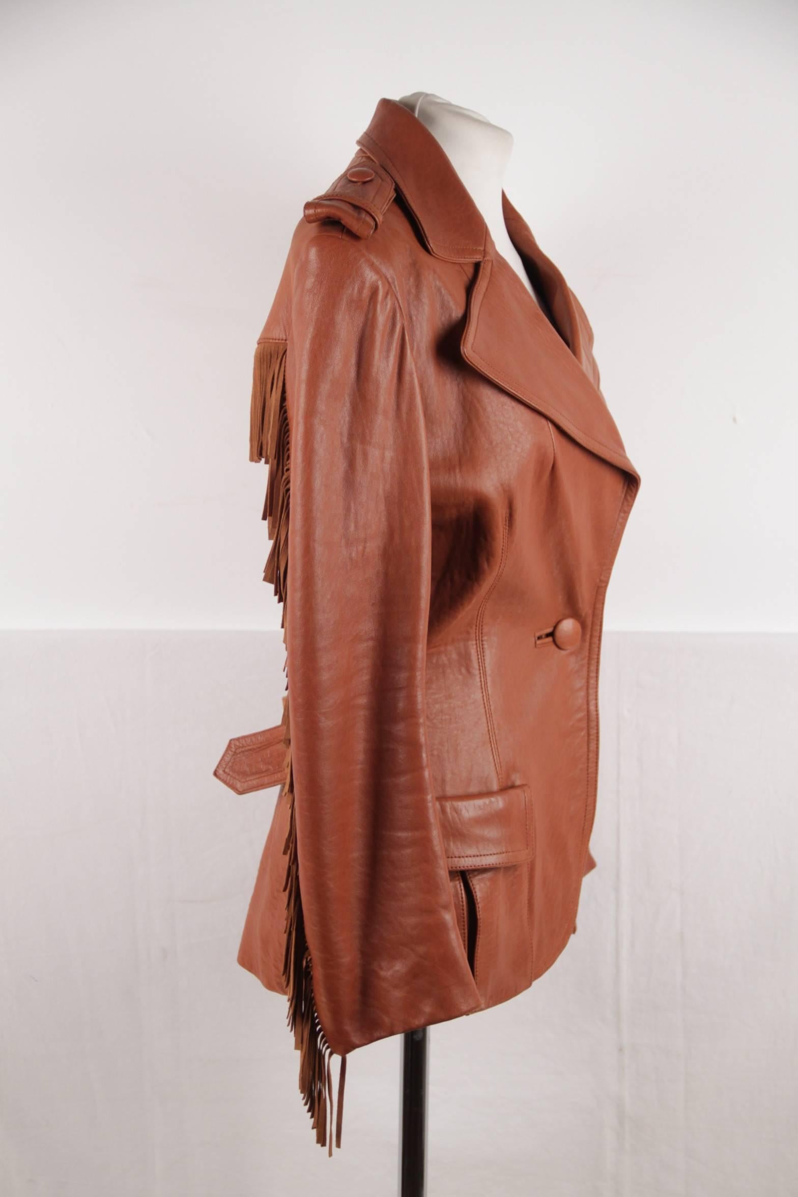 - Lanvin fringed jacket from the winter 2005 season
- 100% lambskin leather
- Cowboy/western styling
- It has a row of fringe across the back and down the sleeves
- Notched lapels
- 2 pockets
- Belt to pull in the waistline
- Silk lining
-