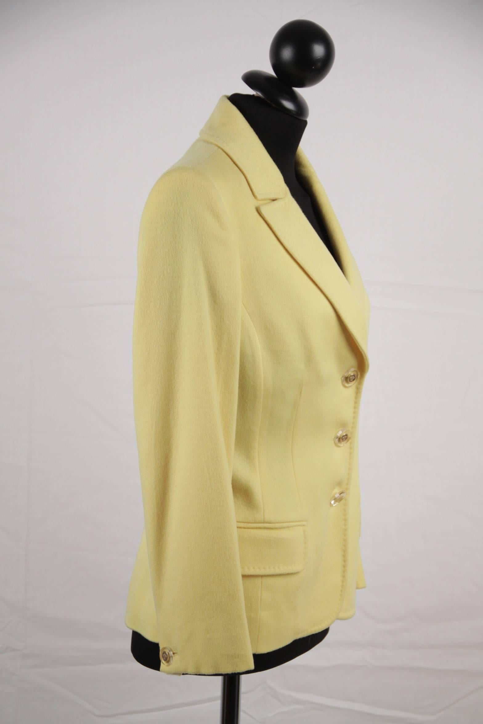 
- Bright yellow cashmere blazer t from the 2005 Fall Ready-to-wear collection by VERSACE
- Lapel collar
- Seam details throughout
- Dual flap pockets at waist
- Button closure on the front (MEDUSA buttons)
- 100% silk lining with colorful