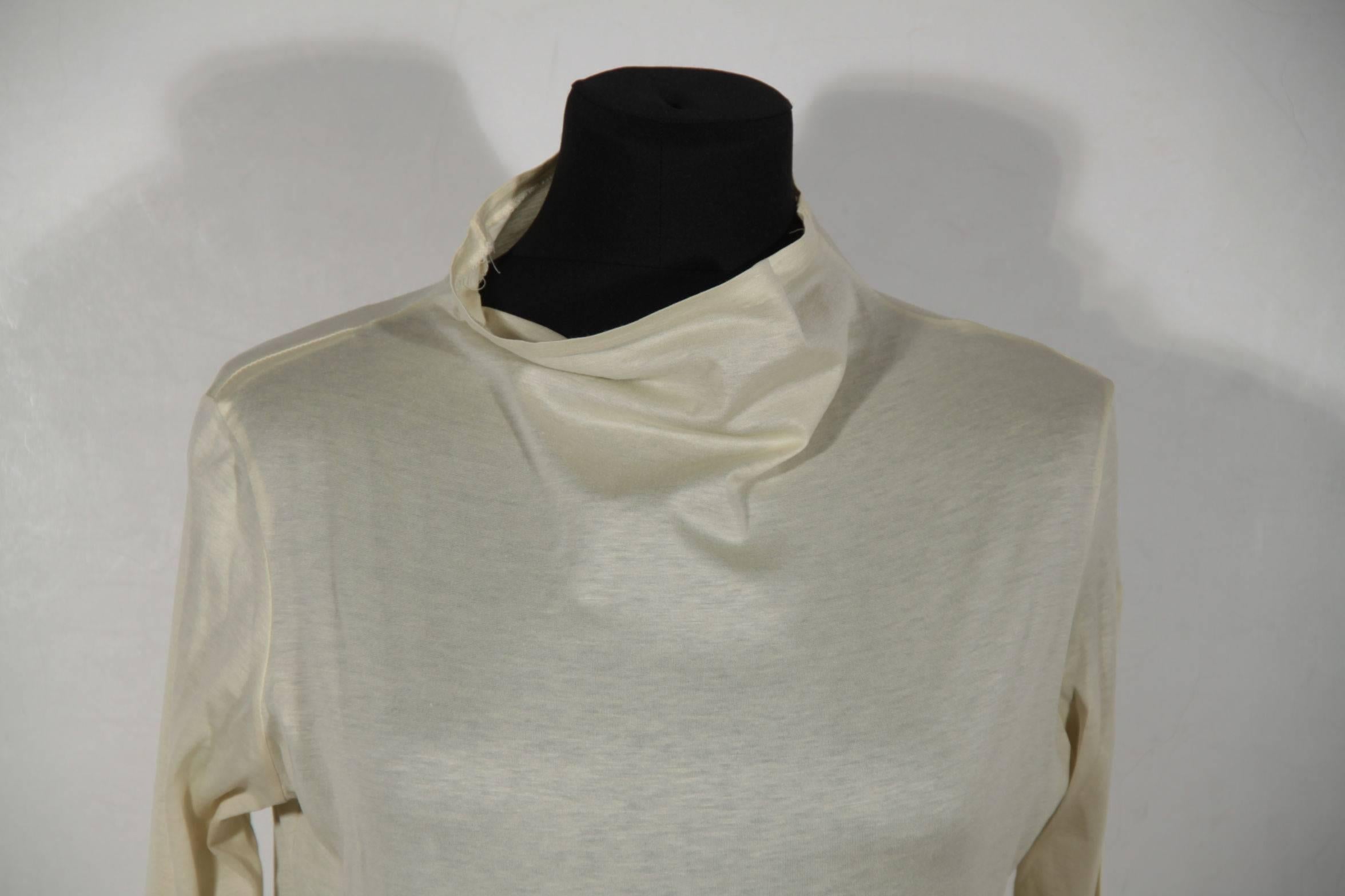 - Long sleeve styling

- Funnel collar

- Composition tag is missing! It seems to be cotton

Logos / Tags: 'YOHJI YAMAMOTO' siganture tag, size tag (MEDIUM)

Condition (please read our condition chart below):VERY GOOD: Previously worn with