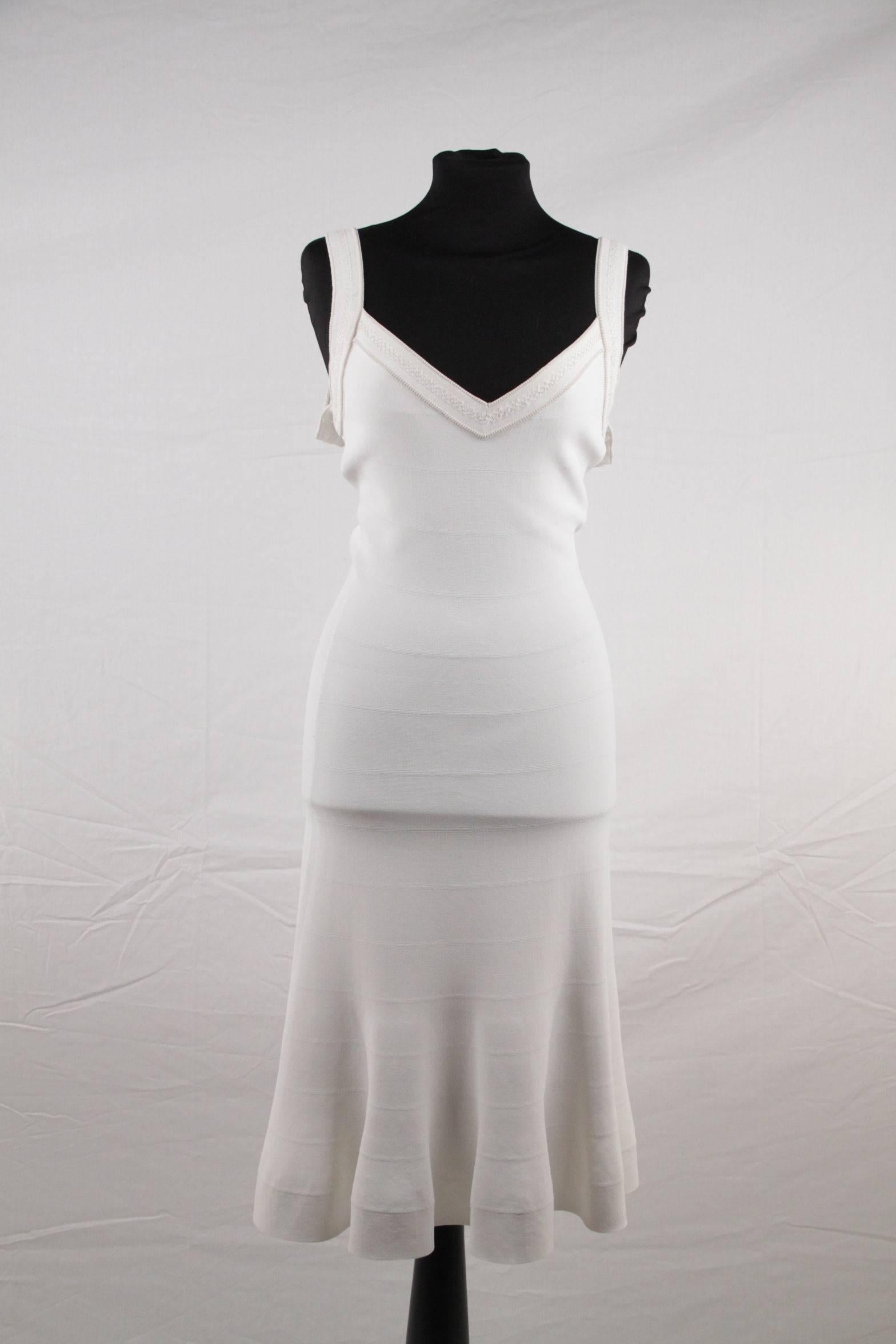  - Composition: 87% Viscose, 8% Nylon, 5% Polyester
- White color
- A line dress with full skirt, easy yet chic!
- V-neckline
- Seam detail throughout
- Sleeveless design
- Unilned
- Made in Italy
- Size is not indicated. Estimated size is a