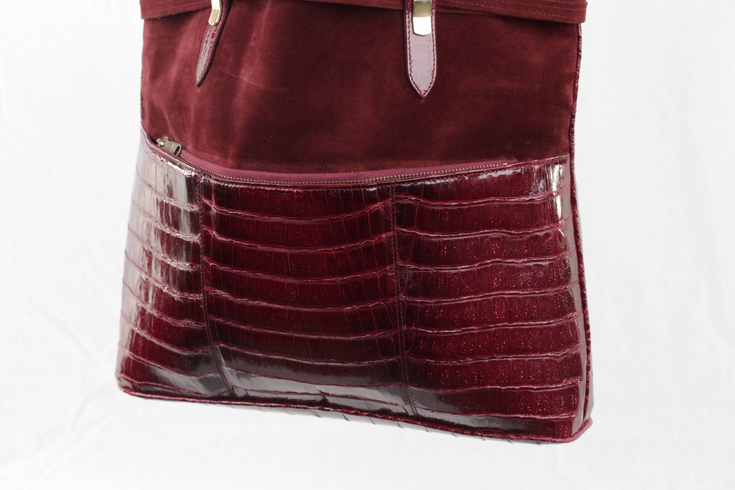  - Vintage shopping bag crafted in suede & crocodile
- Burgundy color
- Gold metal ardwarer
- 2 exterior zip pockets (one on the front and one on the back)
- Burgundy leather lining
- 2 side zip pockets on inside
- Approx. measurements: 15 1/2