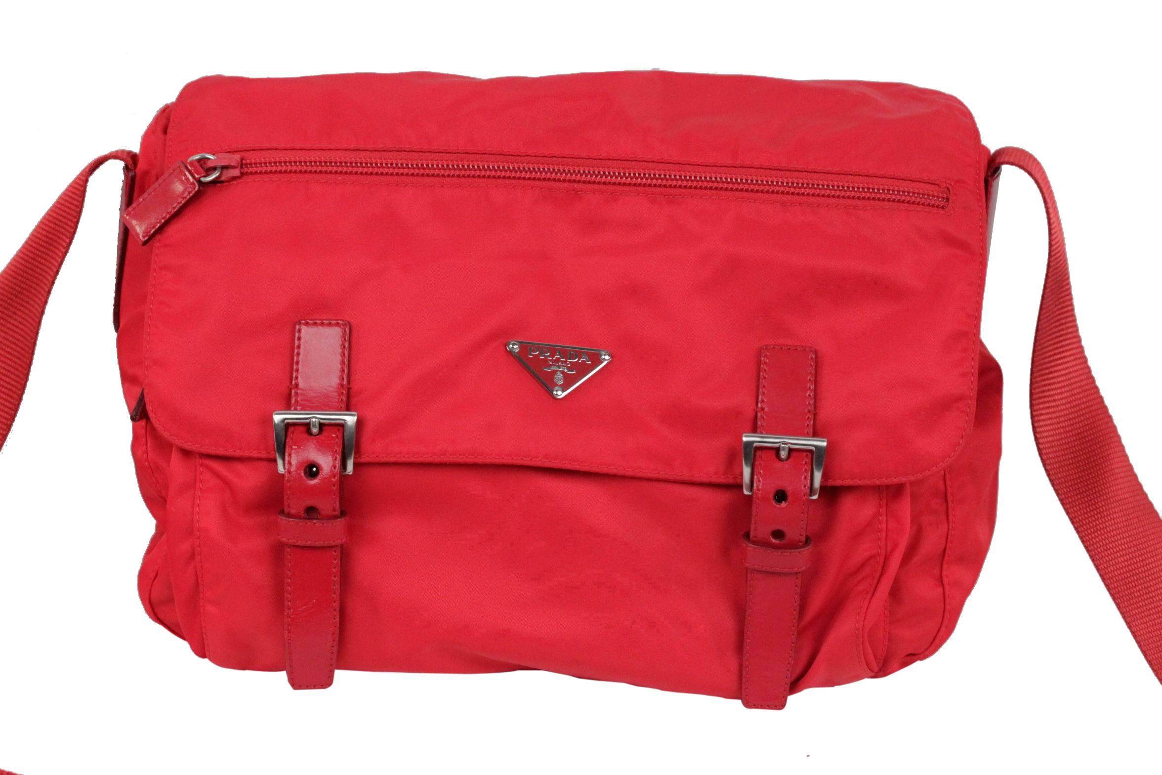 
- Color: Red
- Nylon messenger bag with leather trim
- Silver metal hardware
- Prada logo lining
- Tag logo on the inside and enamel triangle logo on the front
- Flap with double buckle closure
- 1 zipper compartment on the flap and 1 zip