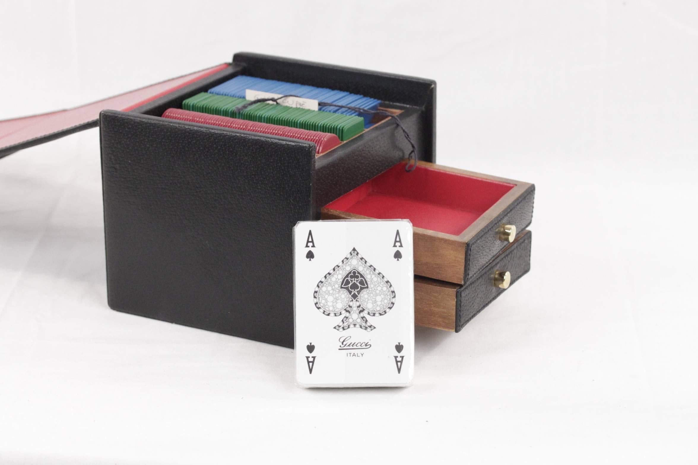 - Unique GUCCI Poker set contained in an elegant black cube box with metal GG - GUCCI logo and Green/Red/Green striped detailing on the front

- The box is crafted ingenuine leather it has 2 small drawers inside

- Red leather lining

- The