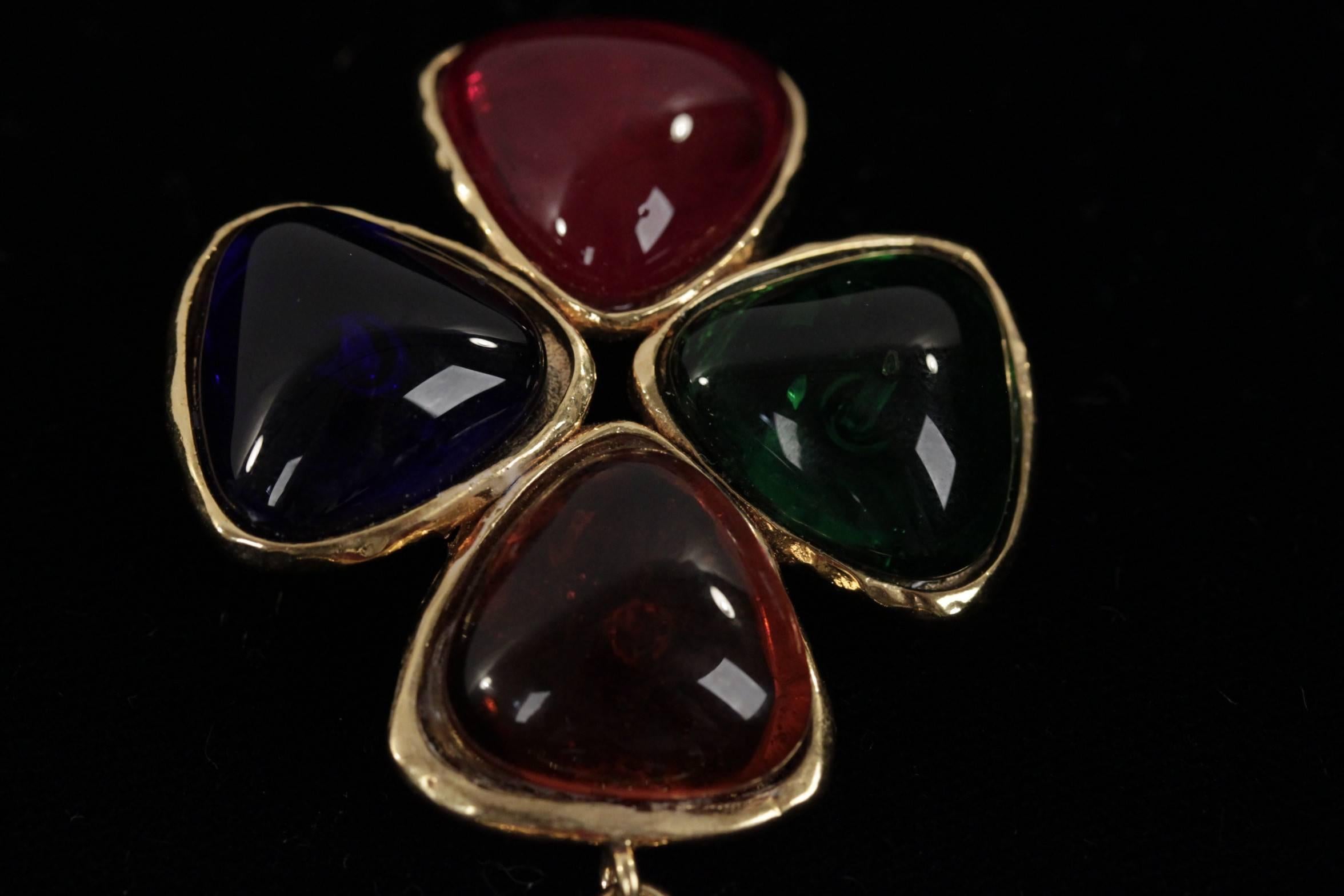  Gorgeous CHANEL Gripoix poured glass brooch or pendant. Brooch is finished in a shiny golden mounting, with multicolor poured glass cabochons. The central focus is the iconic clover - Hook on the back. This brooch is from the 1994 fall collection.