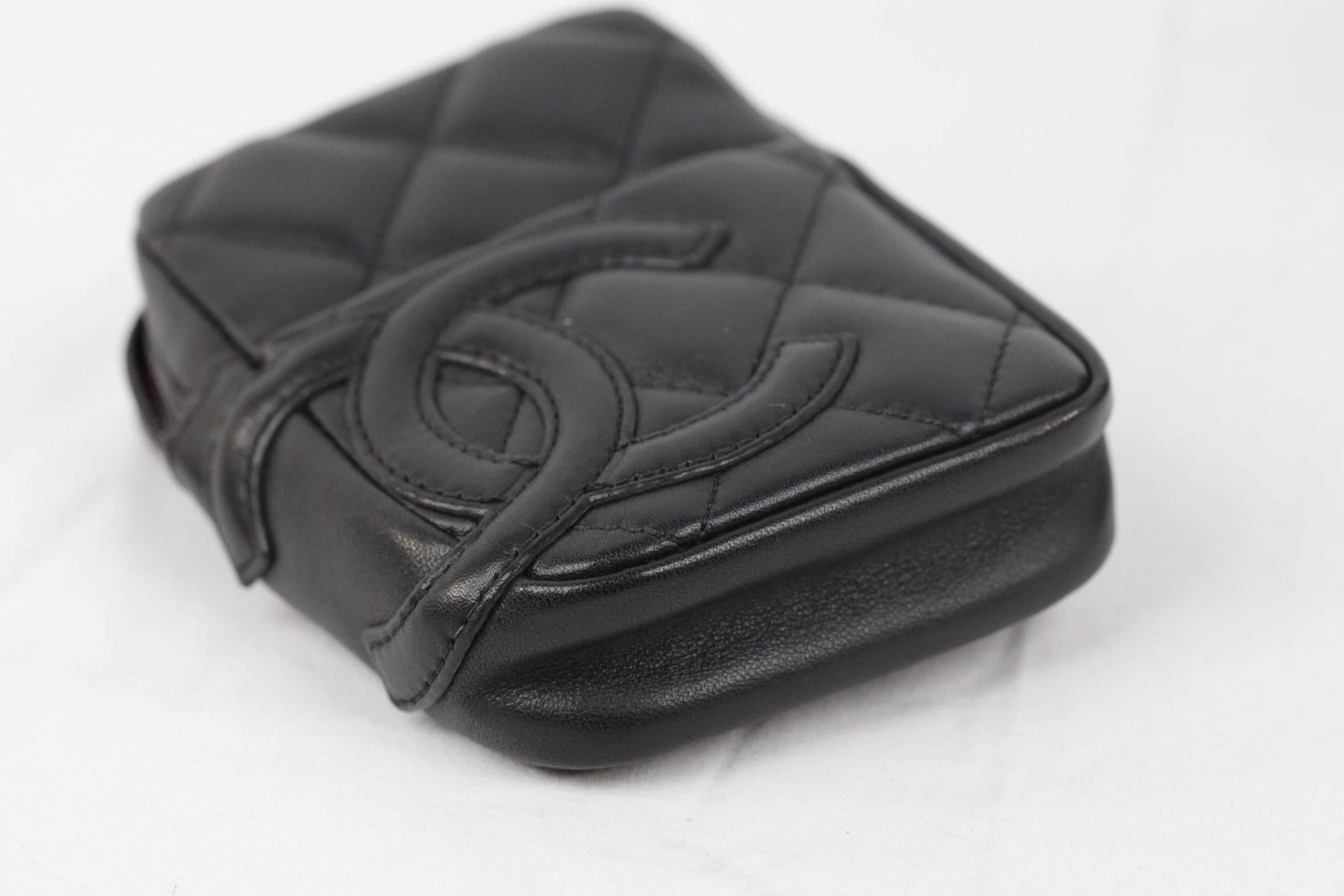  - Crafted of luxurious diamond quilted leather with a large Chanel CC leather logo patch
- The case has a front open pocket for a lighter
- Zip closure on top with Silver metal chain zipper pull
- Opens to a fuchsia fabric interior
- A leather