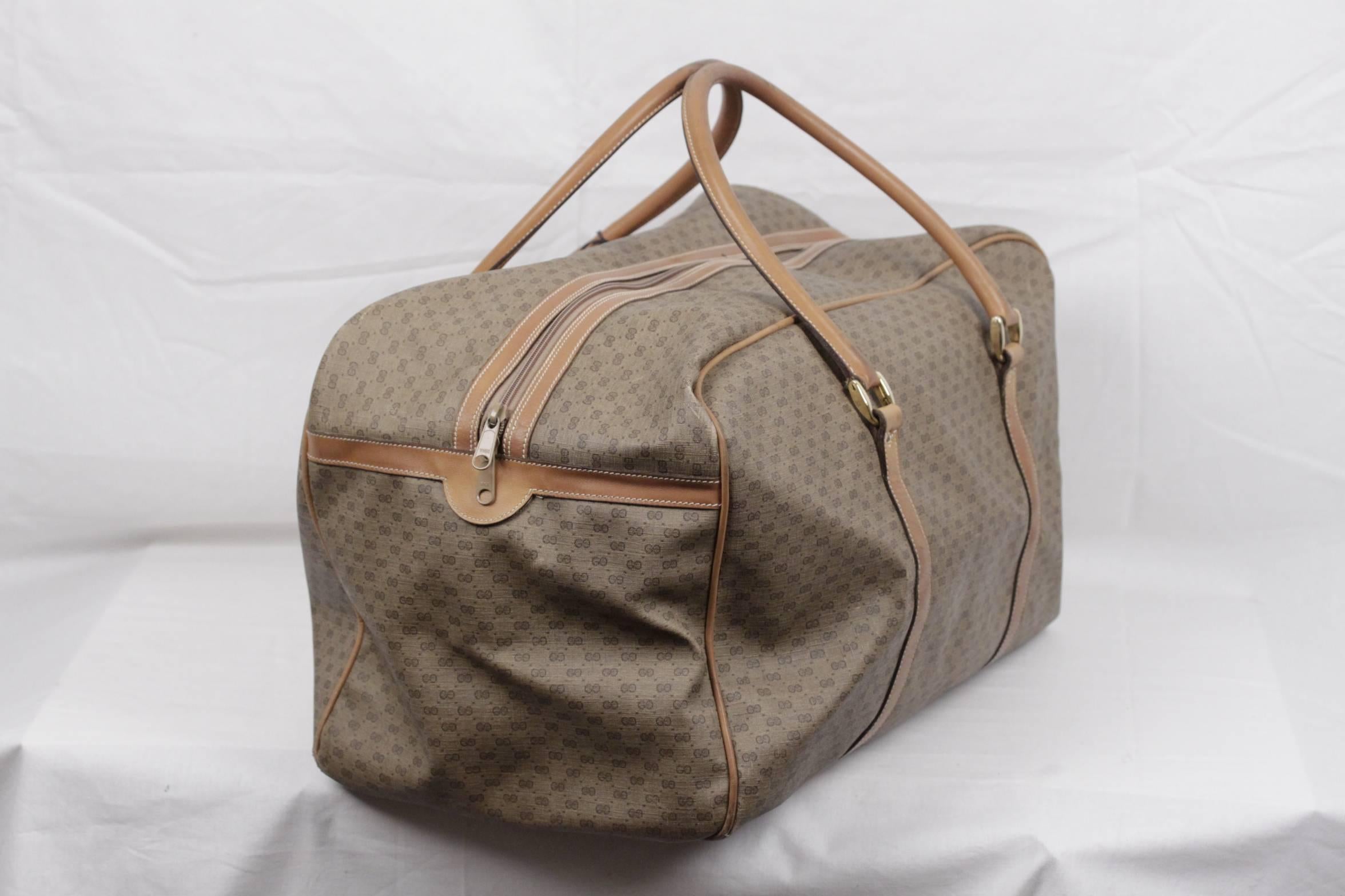  - Vintage GUCCI Weekender / Travel Bag

- Tan GG - GUCCI Monogram Canvas with Genuine Leather trim

- Upper zipper closure

- 1 open pocket on the front

- Beige canvas lining

- 1 large zip pocket inside

- Top carry handles and