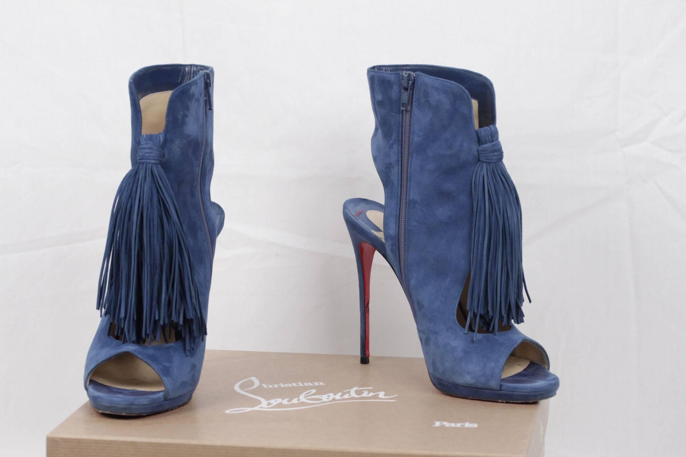  - Christian Louboutin blue suede ankle boots
- Model: Otoka 120
- Color: 'Espadon' Blue
- oversized tassel detail
- 4.8 inches - 12 cm covered stiletto heels
- Peep toe
- Glove vamp with exposed arch
- Cutout over heel
- Side zip eases