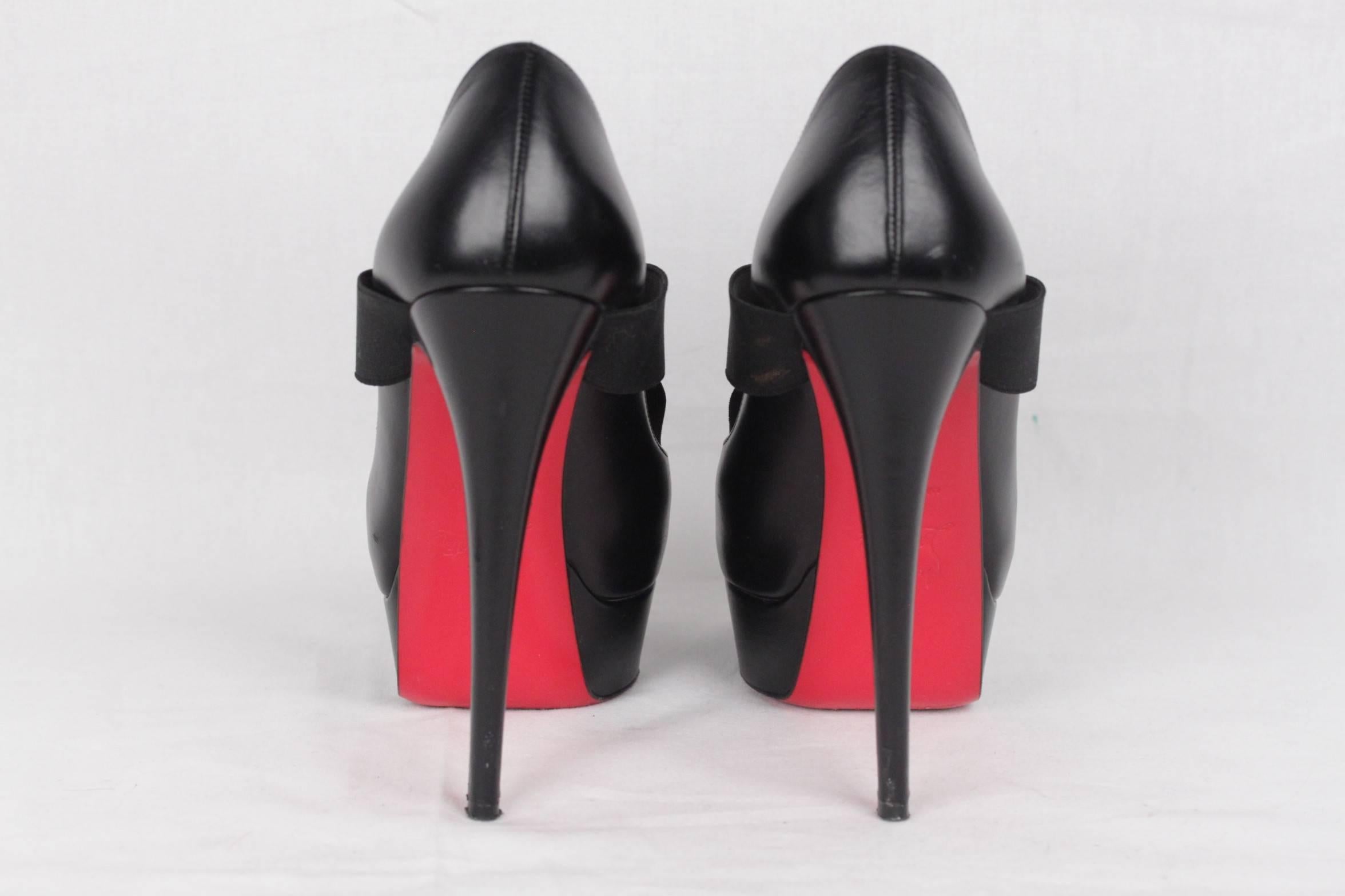 - Christian Louboutin platform peep toe style heels
- Model: 'Very Stagram' 150
- Black leather
- Bondage-esque elastic cross strap.
- Heel Height : 5.9 inches approx. - 150 mm approx.
- Front Platform : 2 inches approx. - 50 mm approx.
-