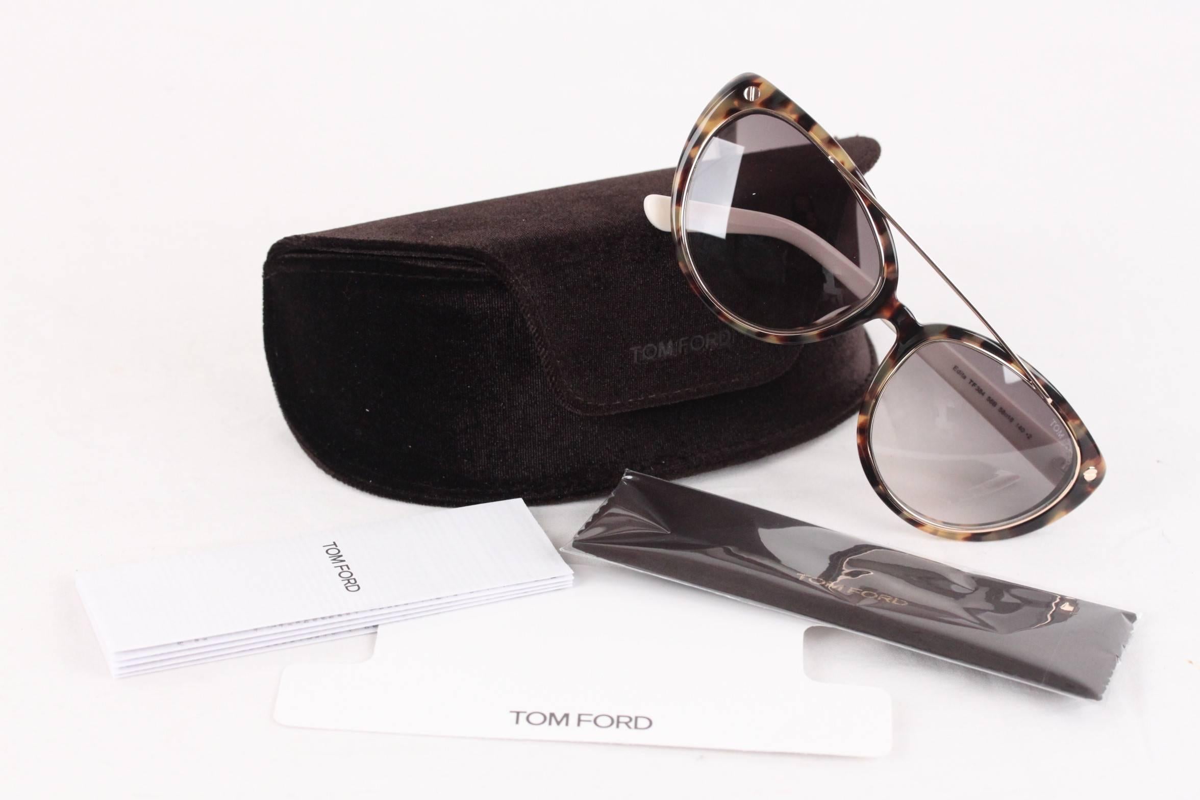 - EDITA TF 384 sunglasses by Tom Ford
- Cat-eye shape with brow bar
- Signature 'T' inset at temples.
- Gradient Smoke (grey) CR-39 lenses. 100% UV protection.
- Made in Italy
- Serial & ref. numbers printed internally
- Retail price is $