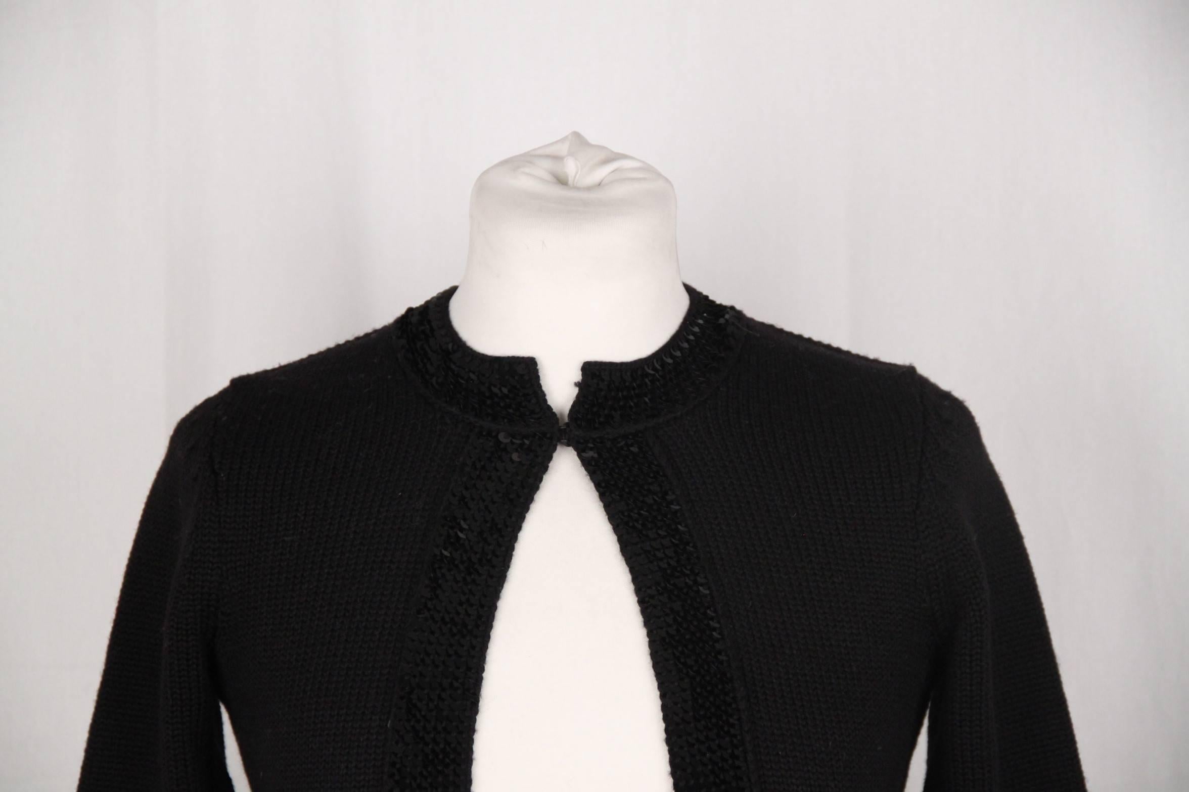 - Black Chanel open front cardigan
- Hook & Eye closure on the neckline 
- 3/4 sleeve
- Sequinned trim 
- Cropped lenght
- Size: 36 FR (The size shown for this item is the size indicated by the designer on the label). it should correspond to a