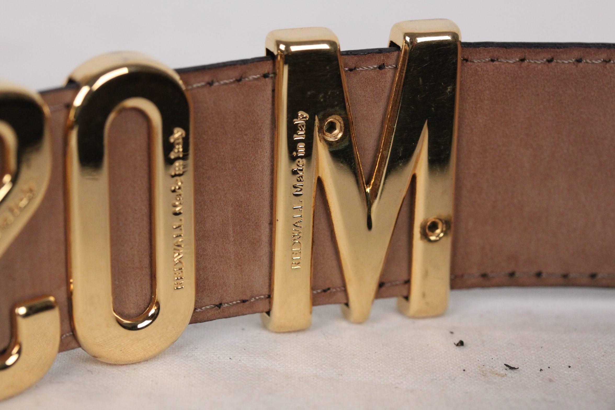 - Stunning vintage lettered belt by Moschino, one of their most famous pieces this is a must have for any true fashionista!
- Black leather belt, tan on the other side
- Gold-tone metal signature letters
- Gold letters apart from The M at the start