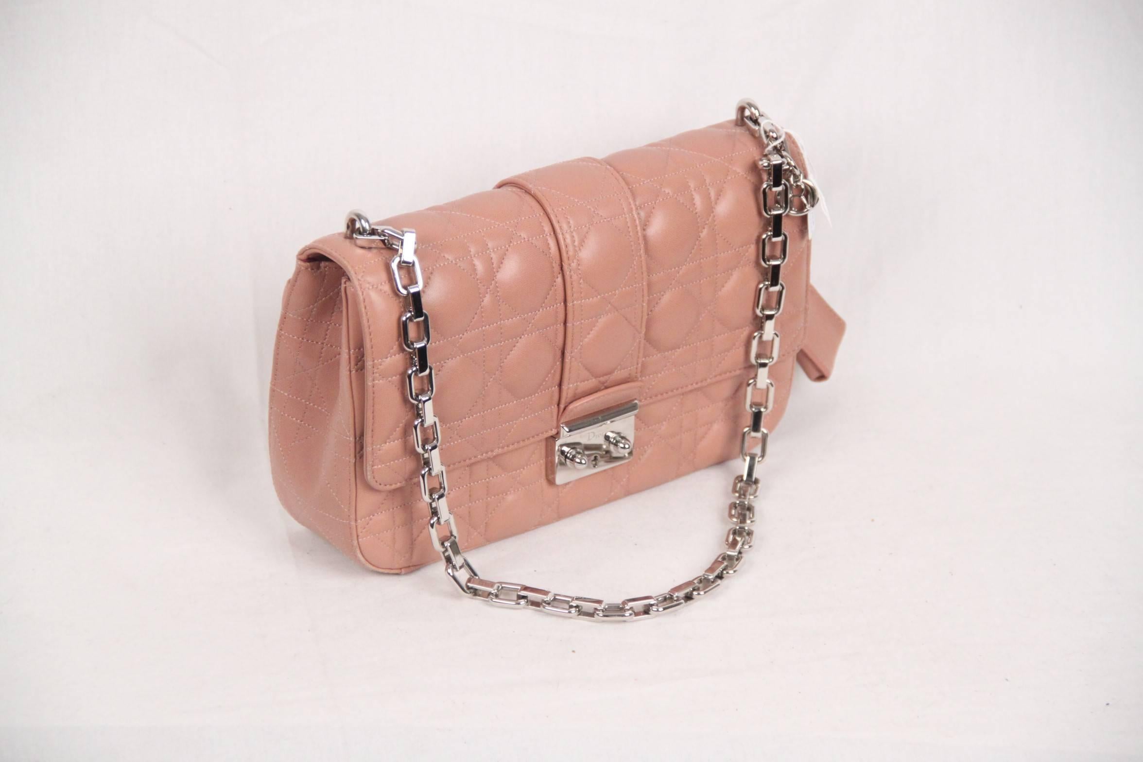 Beautiful MISS DIOR bag in baby pink color. Like the Lady Dior, Miss Dior is enhanced by iconic Dior 'Cannage' stitching. The iconic 'cannage' pattern by CHRISTIAN DIOR is inspired by the Napoleon III chairs used by Mr. Dior in his first ever