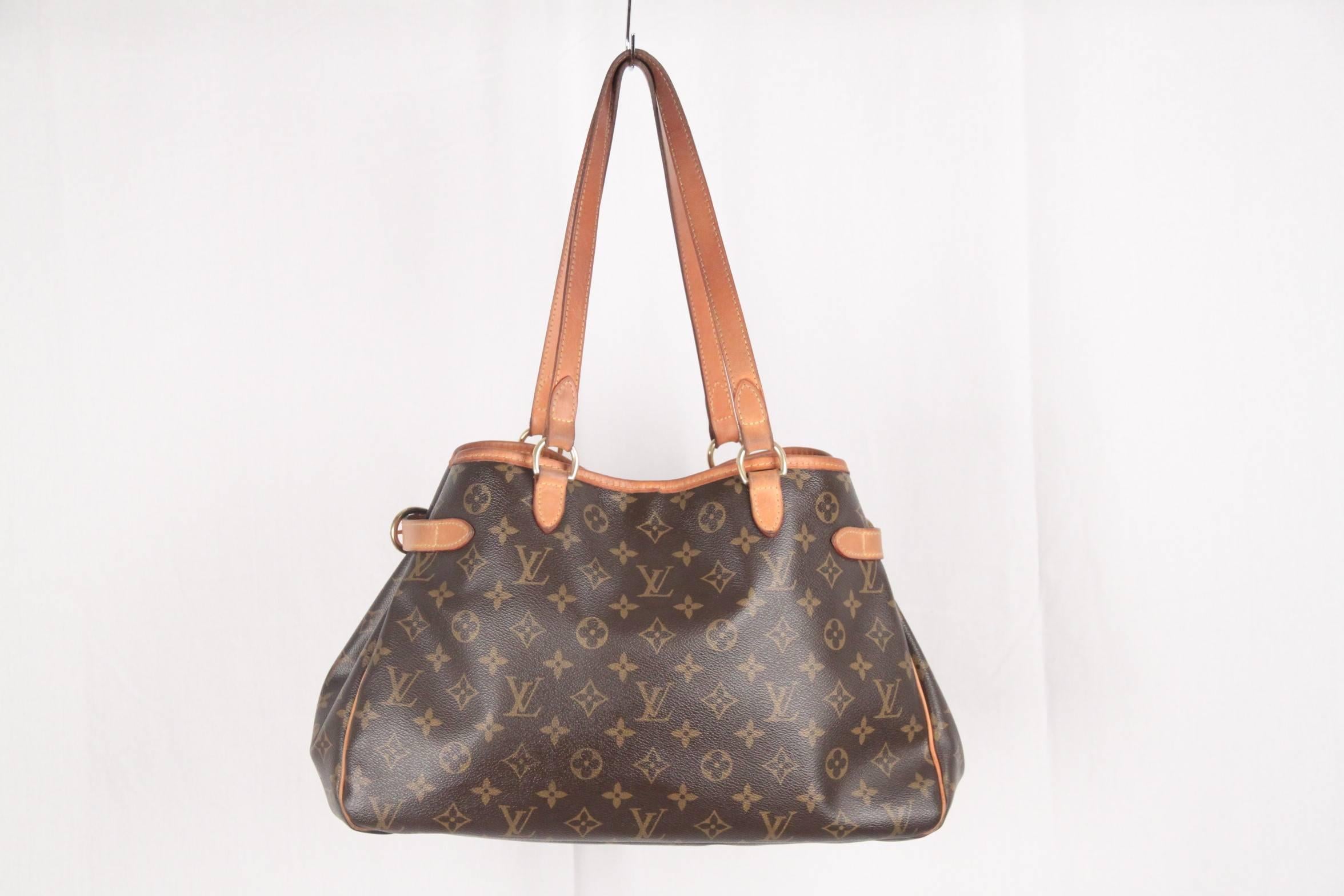 - Brown monogram 'BATIGNOLLES HORIZONTAL' coated canvas tote by Louis Vuitton
- Open top with hook closure in the middle
- Gold metal hardware
- Double top handles
- Open top
- Side buckle detail for expandability 
- Brown canvas lining
- 1 side zip