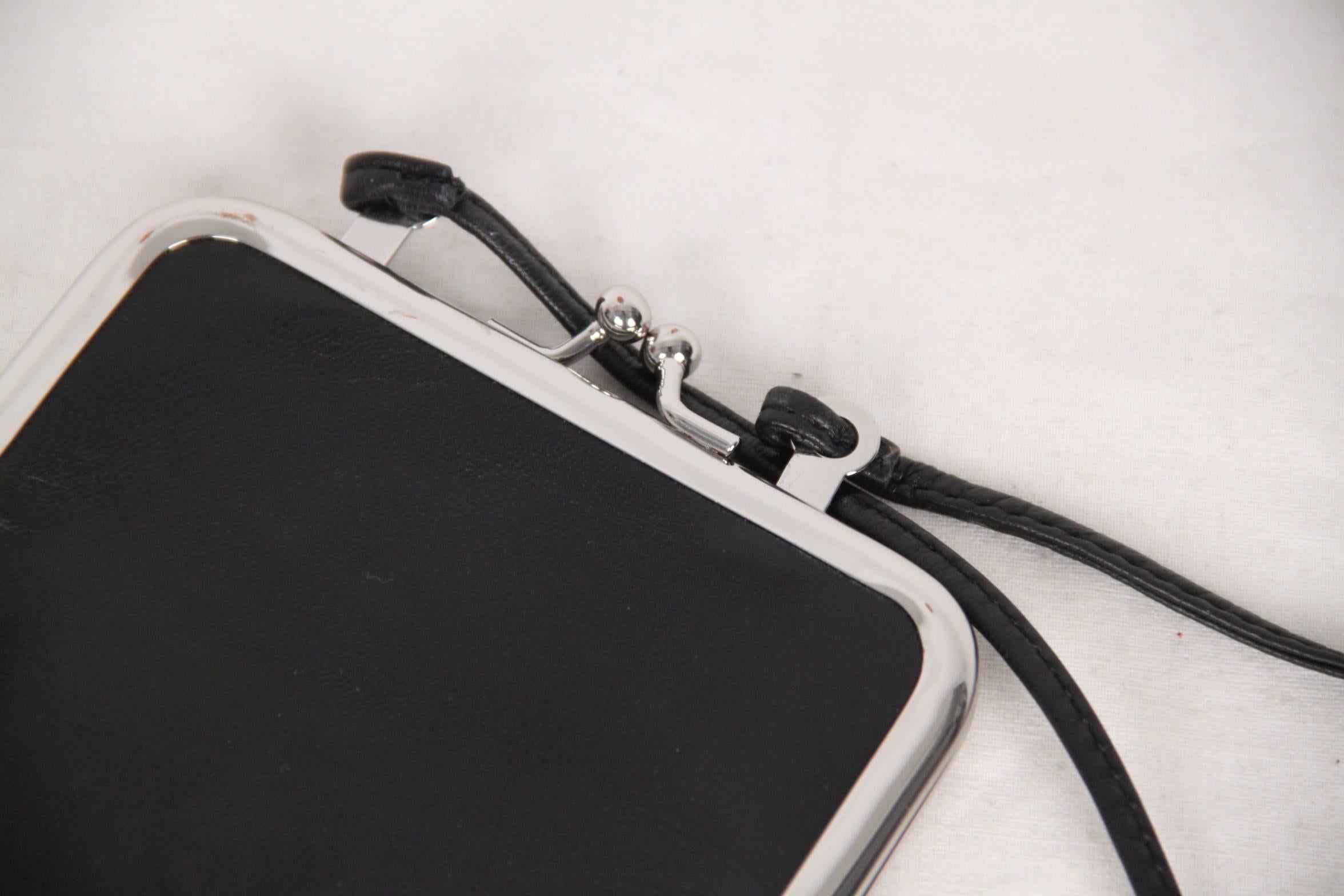 
- Maison Martin Margiela for H&M glove coin purse/bag
- Black genuine leather
- Limited edition piece from the 2012 collaboration with H&M (originally produced in 1999, re-edited by H&M in 2012)
- Silver metal frame with kiss lock