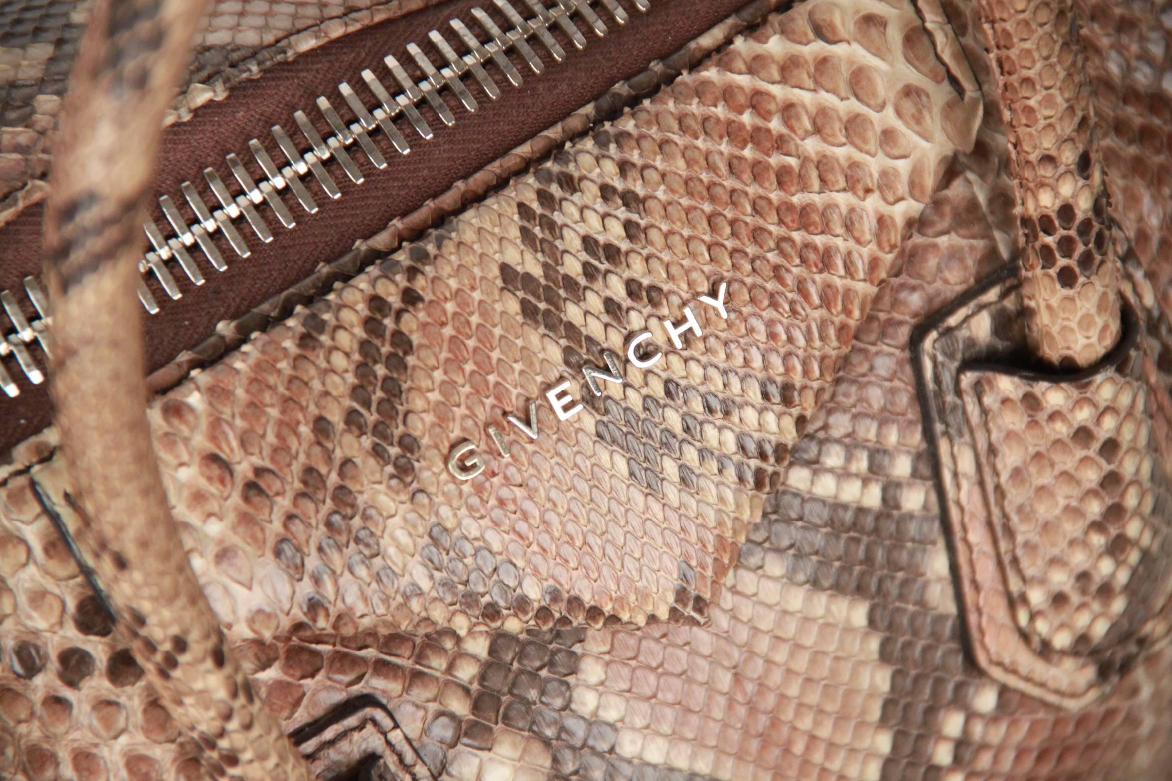 Stunning python GIVENCHY 'Antigona' bag - Medium - in beige python snakeskin. It features envelope flap detail with logo lettering, pale gold tone hardware, upper zipper closure, double python handles and structured base. Lined with black textile