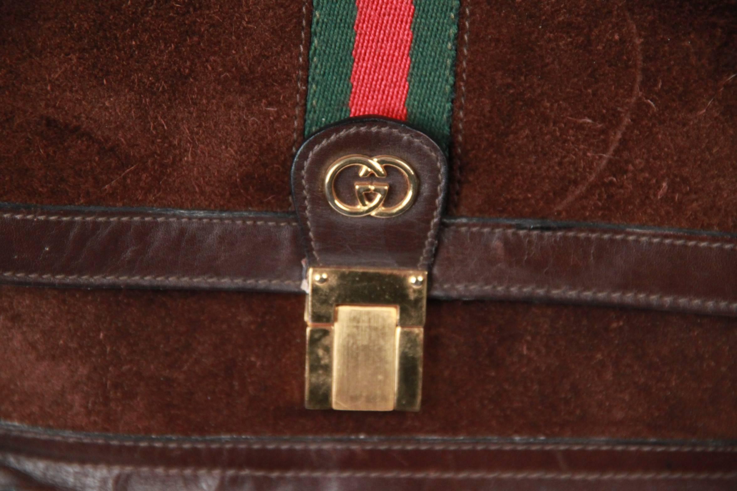- Brown Suede with Genuine Leather trim
- Green7Red/Green GUCCI stripes detailing on the flap
- Gold metal GG - GUCCI logo on the front
- Flap with clasp closure
- 1 front zip pocket
- Removable & adjustable shoulder strap 

Logos / Tags: GG -