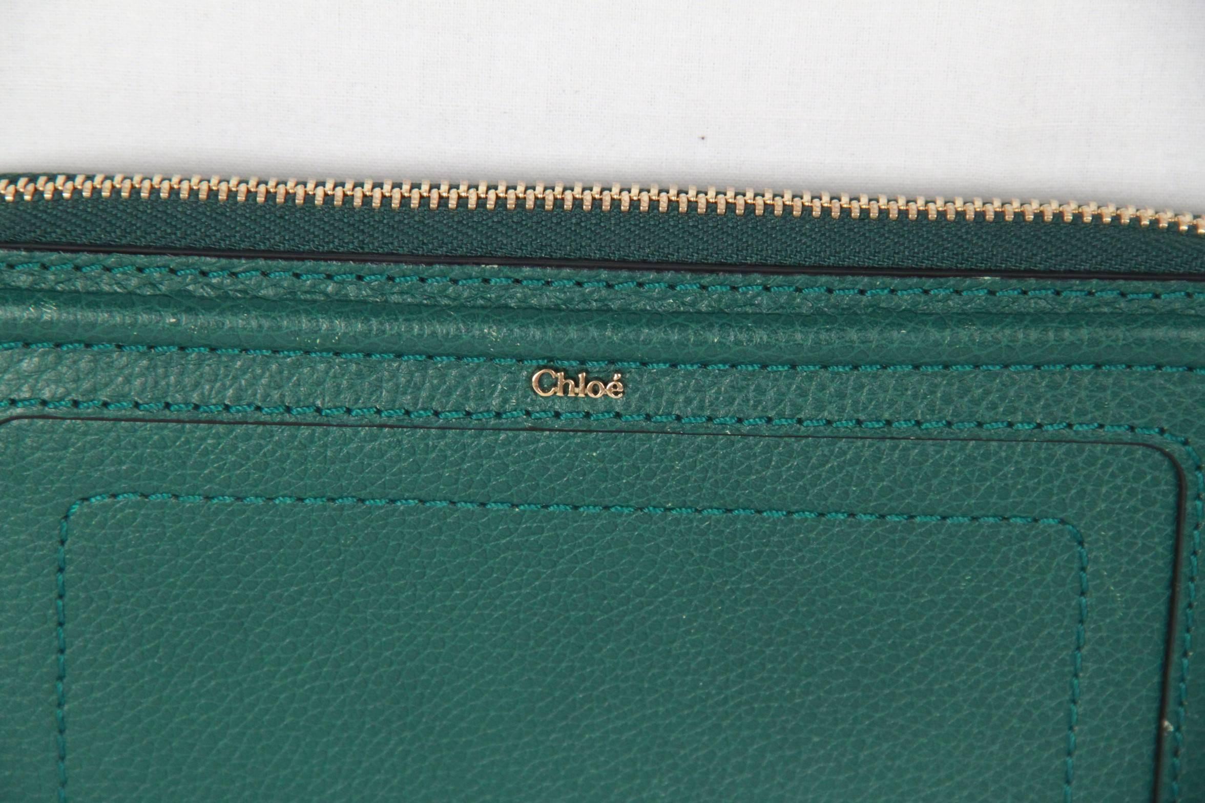 - Continental Wallet by CHLOE, from the 'Paraty' line 
- The style's horseshoe-inspired stitching 
- Pebbled leather with tonal stitching
- Golden hardware
- Piped and topstitched design on front with tubular frame.
- Metal CHLOE logo at center
-