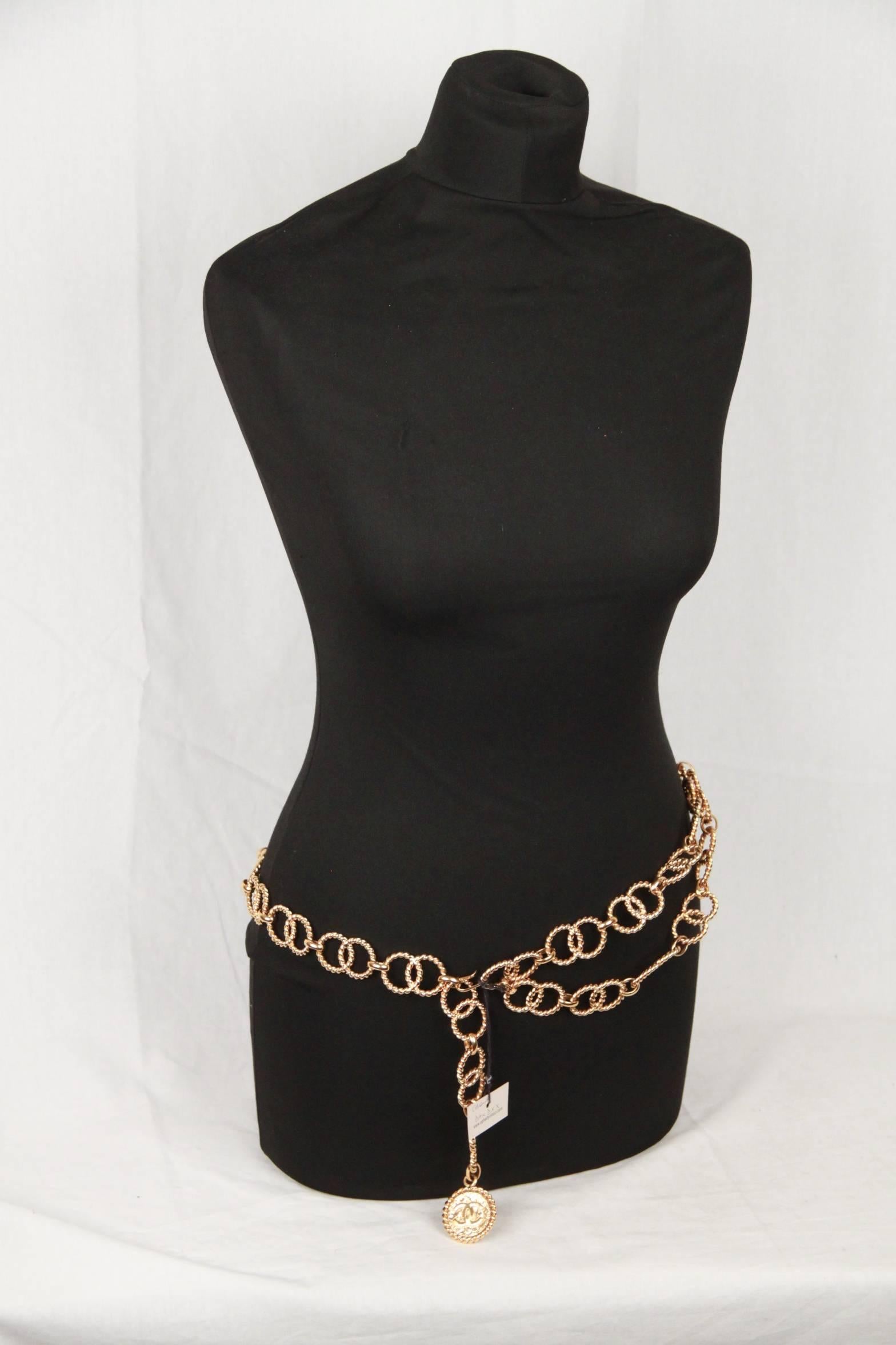 
Gold-tone Chanel multi-strand chain-link belt features larges interlocking rings. Double strand drop to sit at the waist with a single strand to clasp at the perfect spot for you. Gold metal round medallion/charm with interlocking CC at the end of