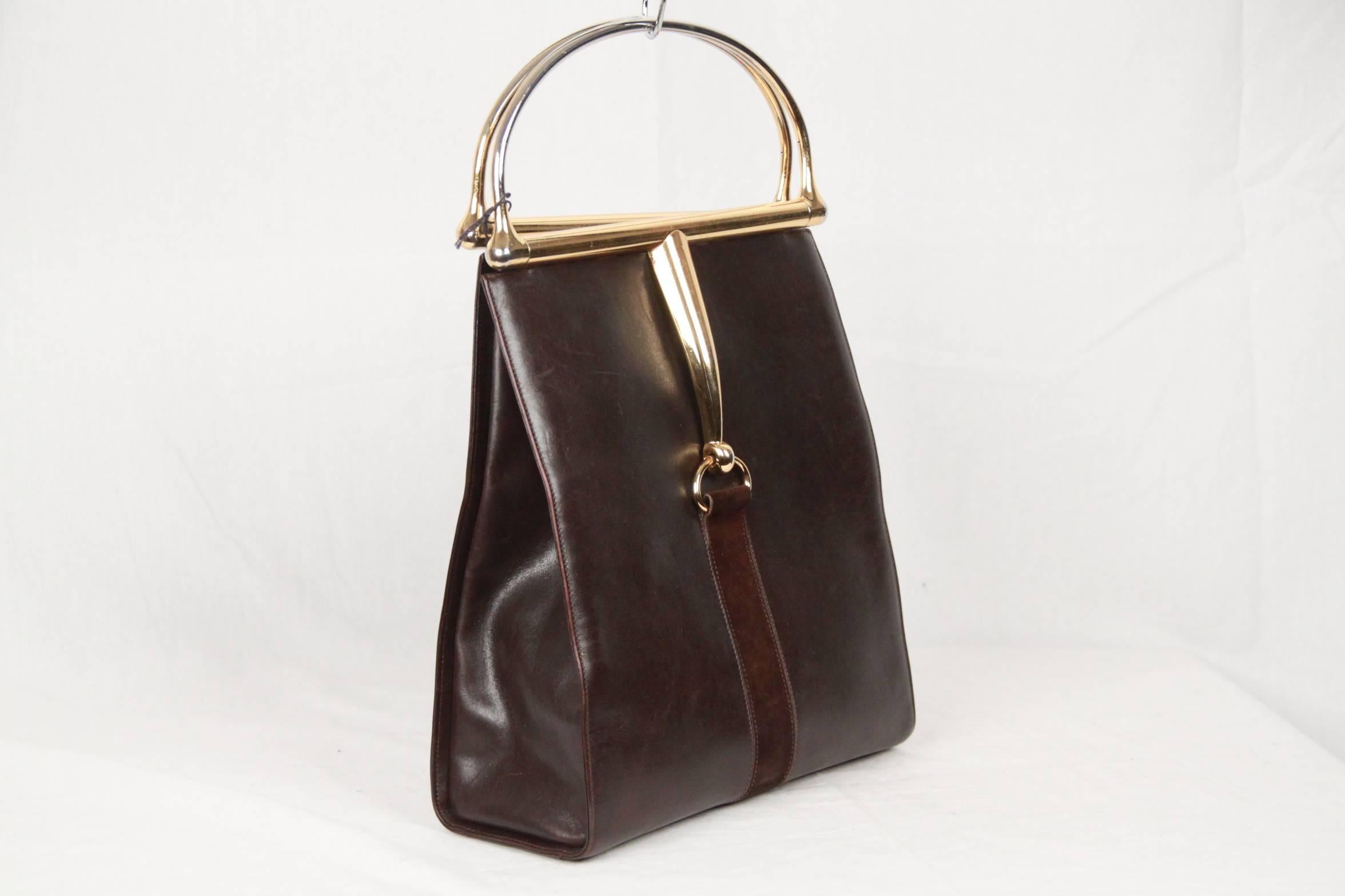 Rare vintage GUCCI Tote Bag from the 60s. Carfted in brown leather with brown suede stripe detailing on the front and on the back. Open top with gold metal horsebit handles. The interior is lined in tag leather and it has 1 side zip pocket. 
Logos