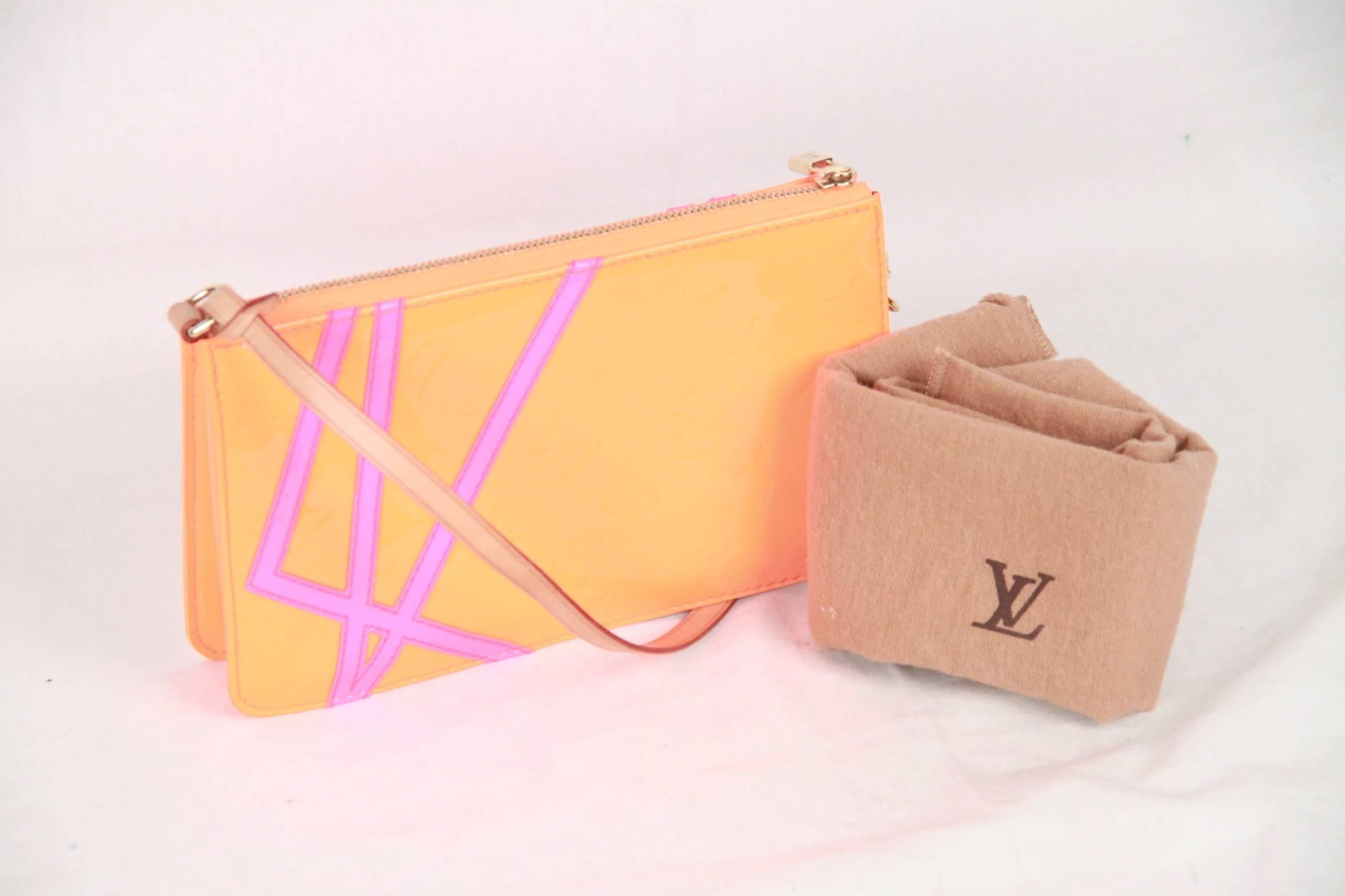 In 2002, Louis Vuitton collaborated with American artist and director Robert Wilson to create a visually striking line of bags in Fluo (fluorescent) Monogram Vernis colors. This is a limited edition LEXINGTON POCHETTE in fluorescent orange Monogram