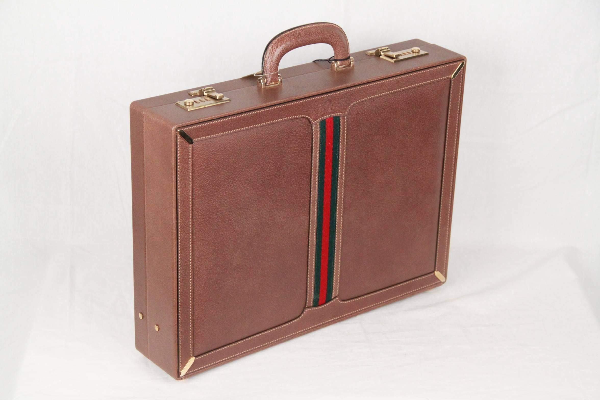 Gorgeous Gucci hard-side briefcase in tan leather, with green/red/green stripes detailing. It is big and strong enough to carry your laptop and also provides plenty of space to organize and dived paper work, pens, phone, buisness cards, and more.