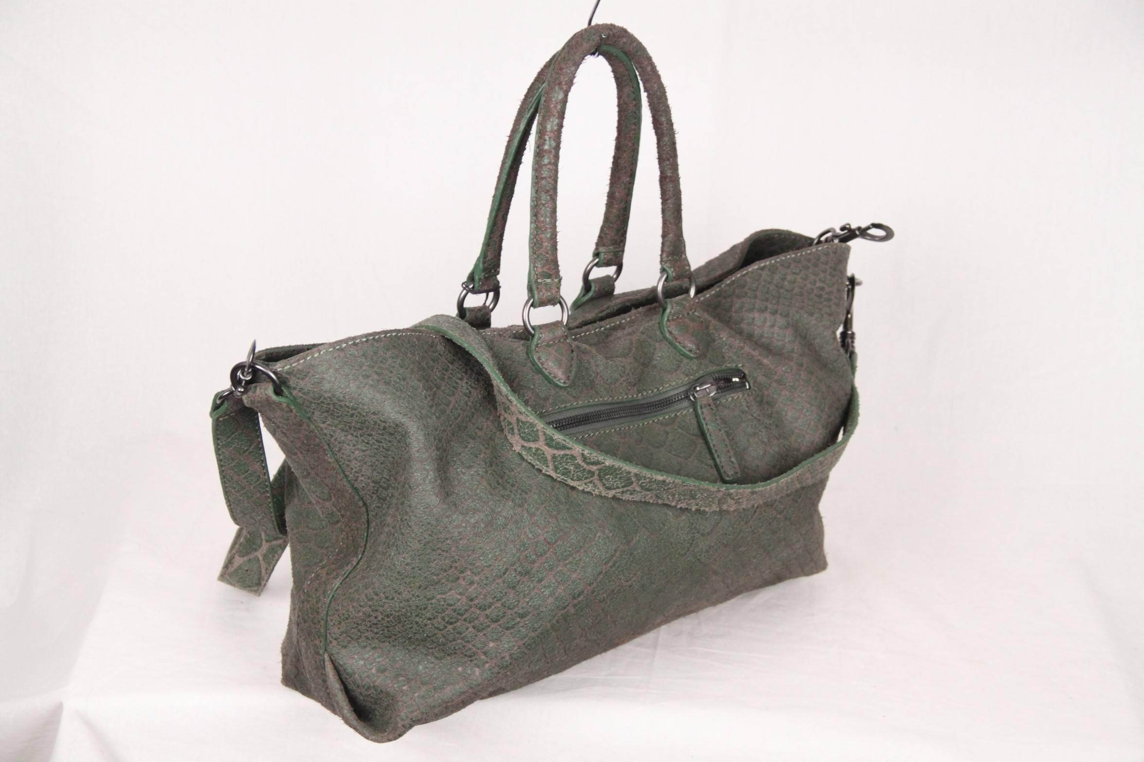 
- Snake embossed leather large 'Maxine' tote with dual rolled top handles
- Green color
- Detachable and adjustable crossbody strap
- Gunmetal hardware
- Front zip pocket
- Magnetic snap button closure
- Snake print lining
- Two interior slip