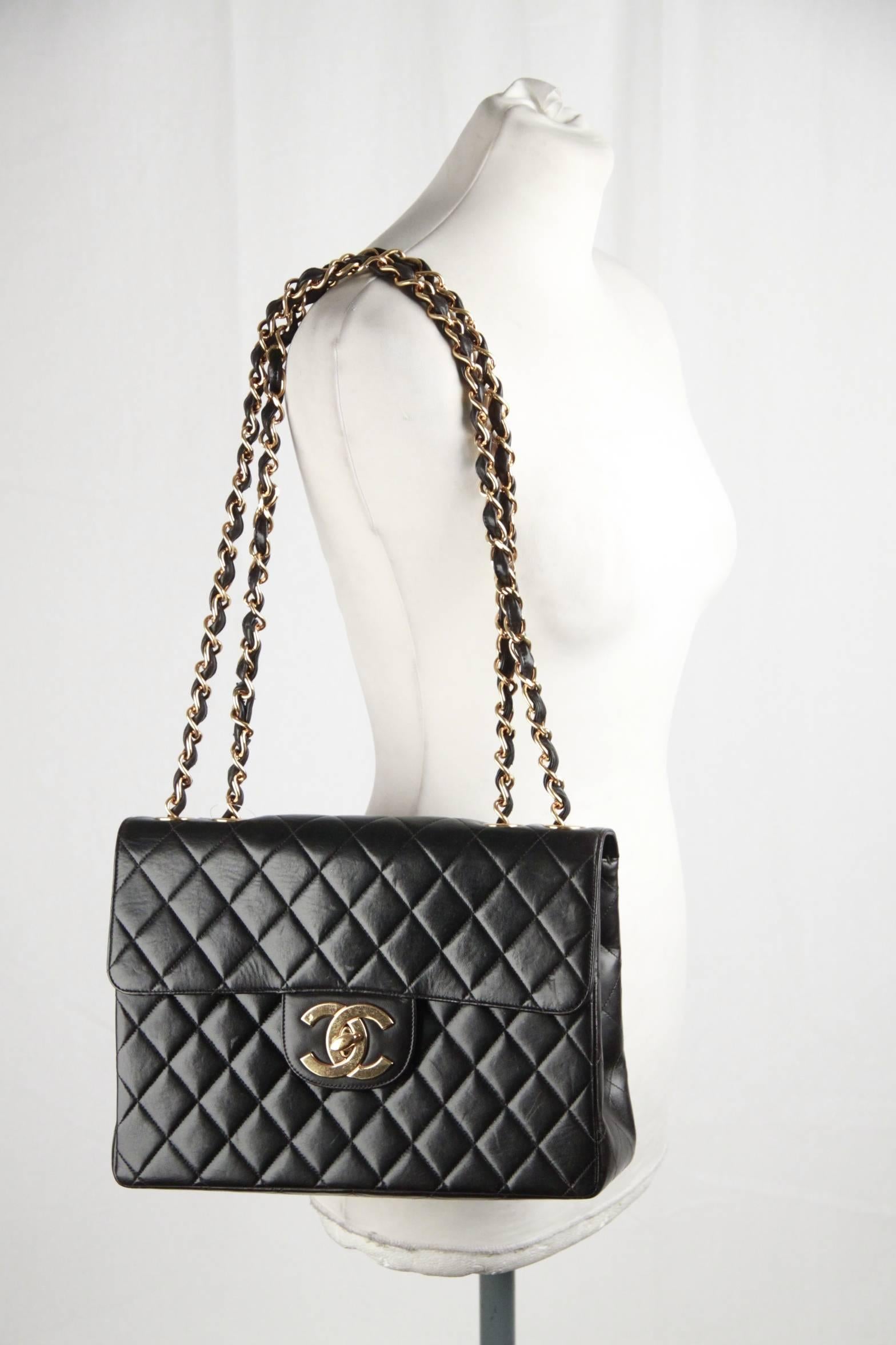 - Vintage Chanel JUMBO Classic Flap Shoulder Bag
- Period/Era: 1996/1997
- Timeless black quilted lambskin leather 
- Signature oversized CC front clasp in 24k gold plated hardware, as with the large chunky Chanel chain
- Classic back pocket
- Lined