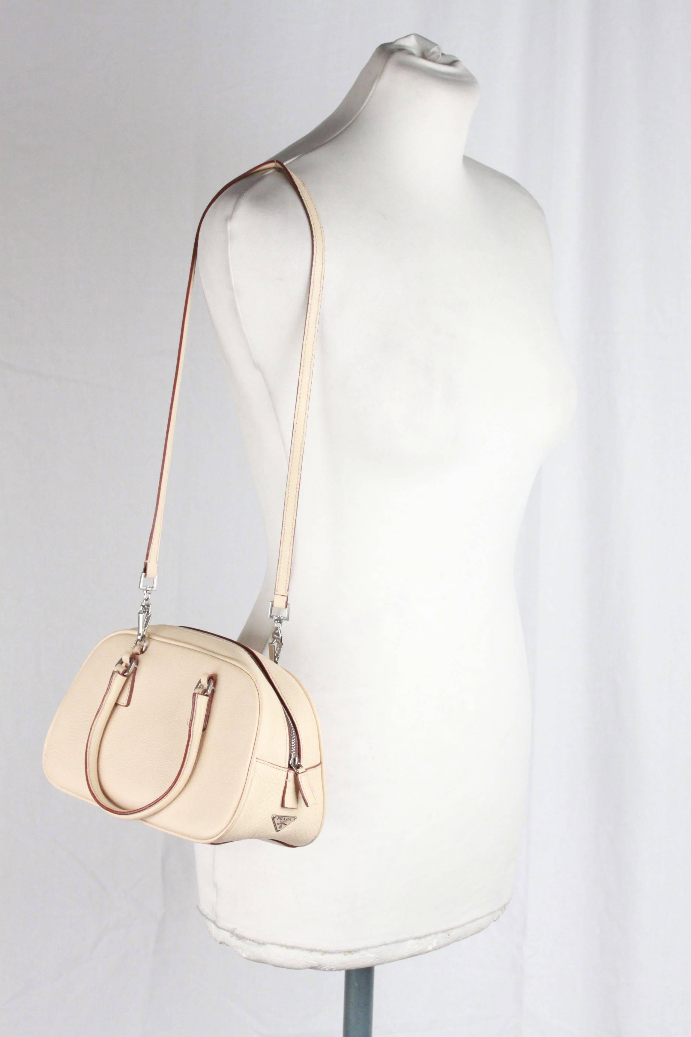 Elegant PRADA top handles  bag/handbag mod. BL0063, designed in Beige 'Daino Sport' leather. It features a removable shoulder strap and double top handles. The interior is fully lined withtan leather. 1 side zip pocket inside Four metal bottom feet