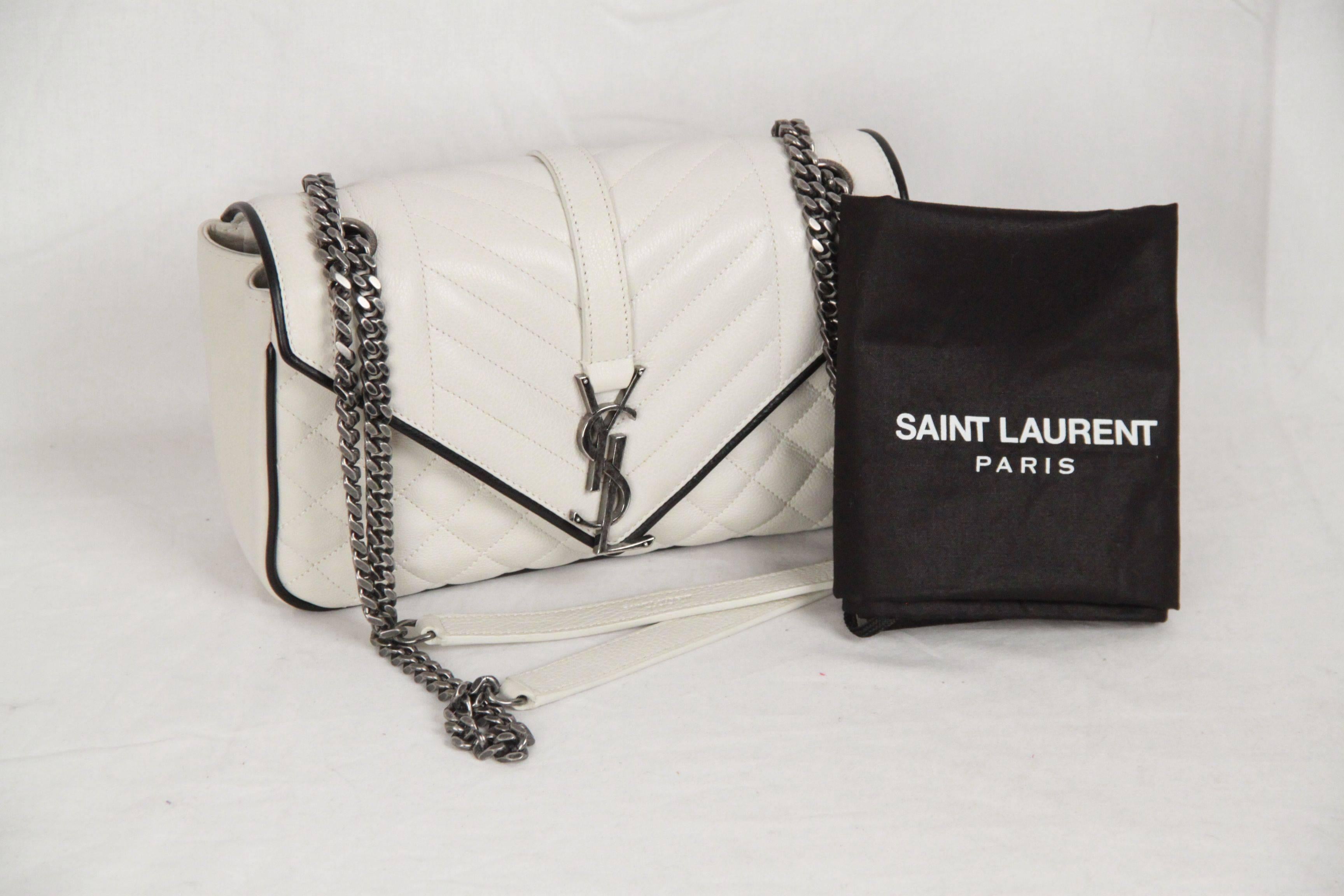 - Saint Laurent 'Tri-quilt' calfskin shoulder bag
- White color with black contrast edges
- Silver metal hardware
- Chain and leather shoulder strap can be doubled (11.8 inches - 30,5 cm drop, when doubled)
- Signature YSL monogram logo on the
