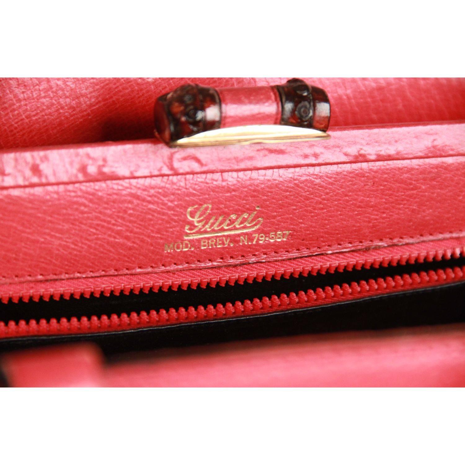 - Vintage GUCCI handbag from the 1960s, crafted in genuine red leather.
- Bamboo detail on the front and on the back
- Bamboo clasp closure
- 1 open compartment on the front and 1 on the back 
- Black Leather lining
- 2 side open pocket and 1 side