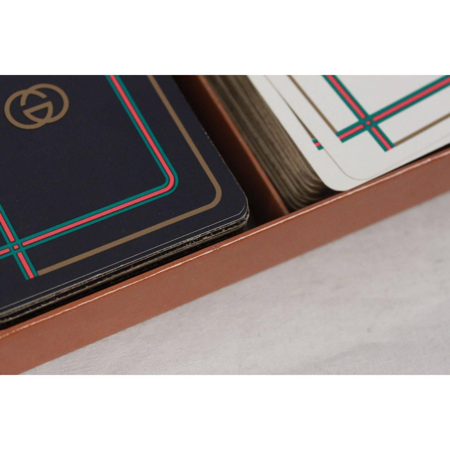 - Very nice & unique GUCCI vintage boxed set of French playing cards
- 3 Decks in 3 different color (Blue, White, Red)
- GG - GUCCI logo on the back of every card
- Each deck has 52 cards, 2 jokers, a score card, plus an insert card.
- The cards are