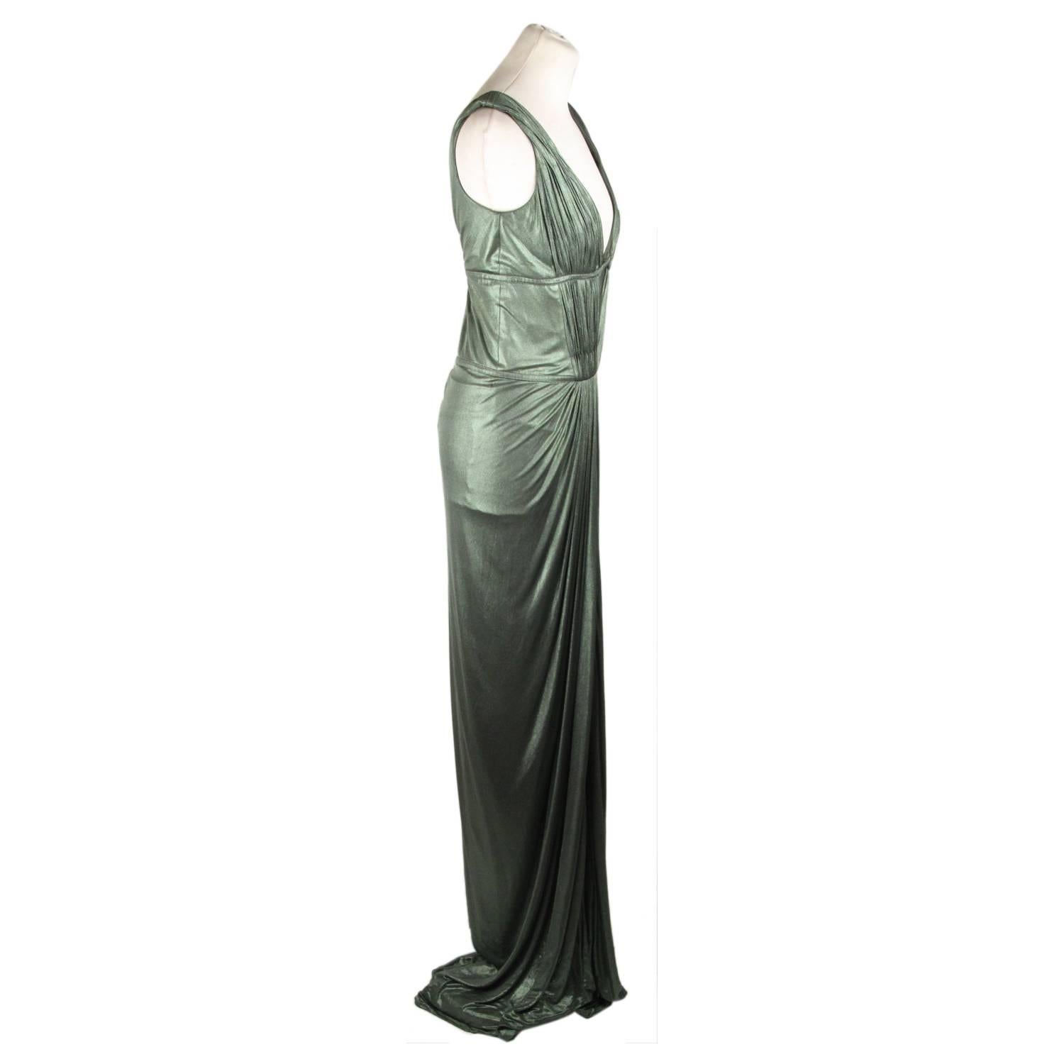 - Beautiful Evening 'Cleopatra dress' gown from the Roberto Cavalli's Fall 2007 Ready-To-Wear collection
- Metallic green 
- Pleated bodice with deep plunge neckline
- Full lenght
- Draped skirt with front slit
- Low V-back 
- Rear zip closure with